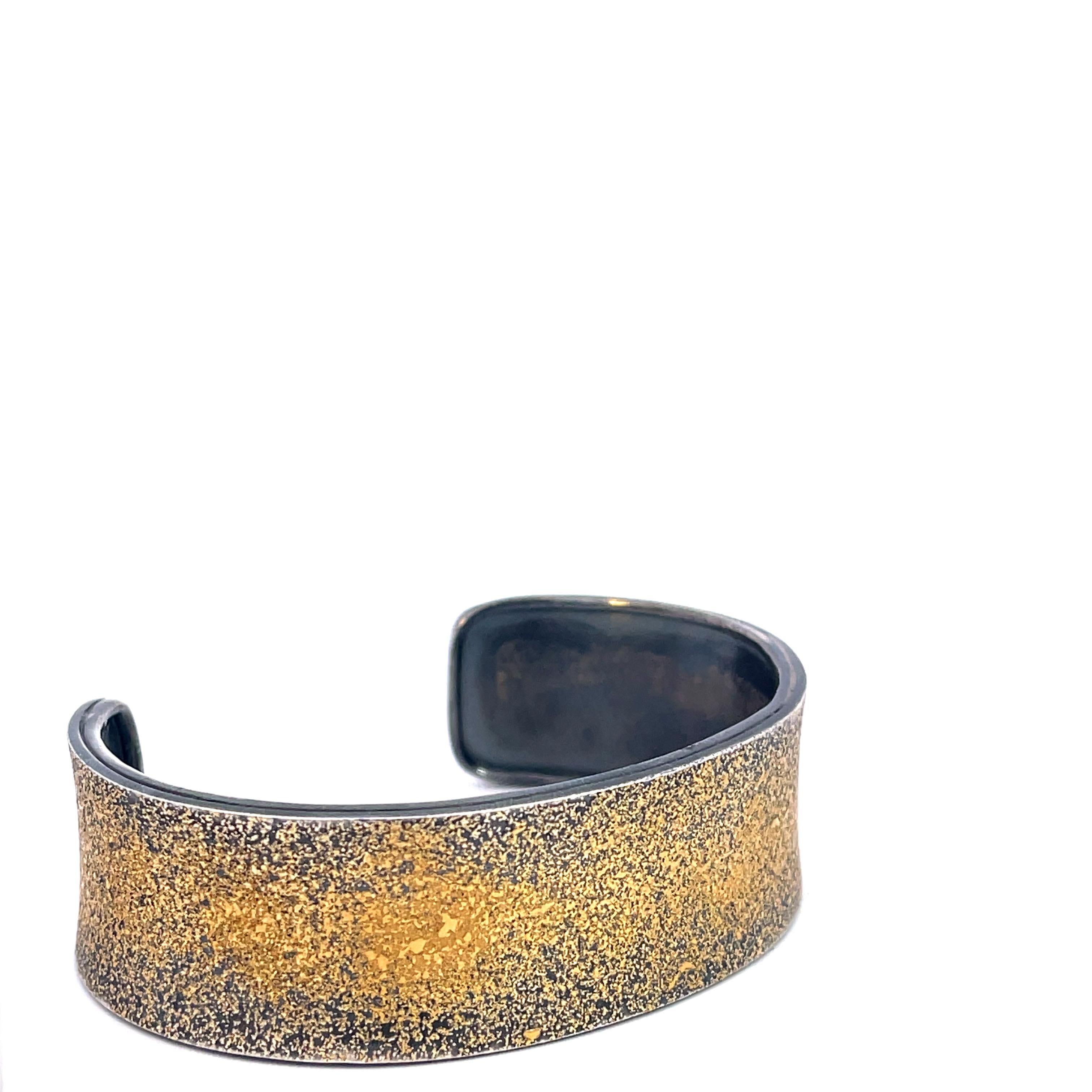 An oxidized sterling silver straight narrow cuff bracelet with 24k gold fairy dust. This cuff was made and designed by llyn strong.