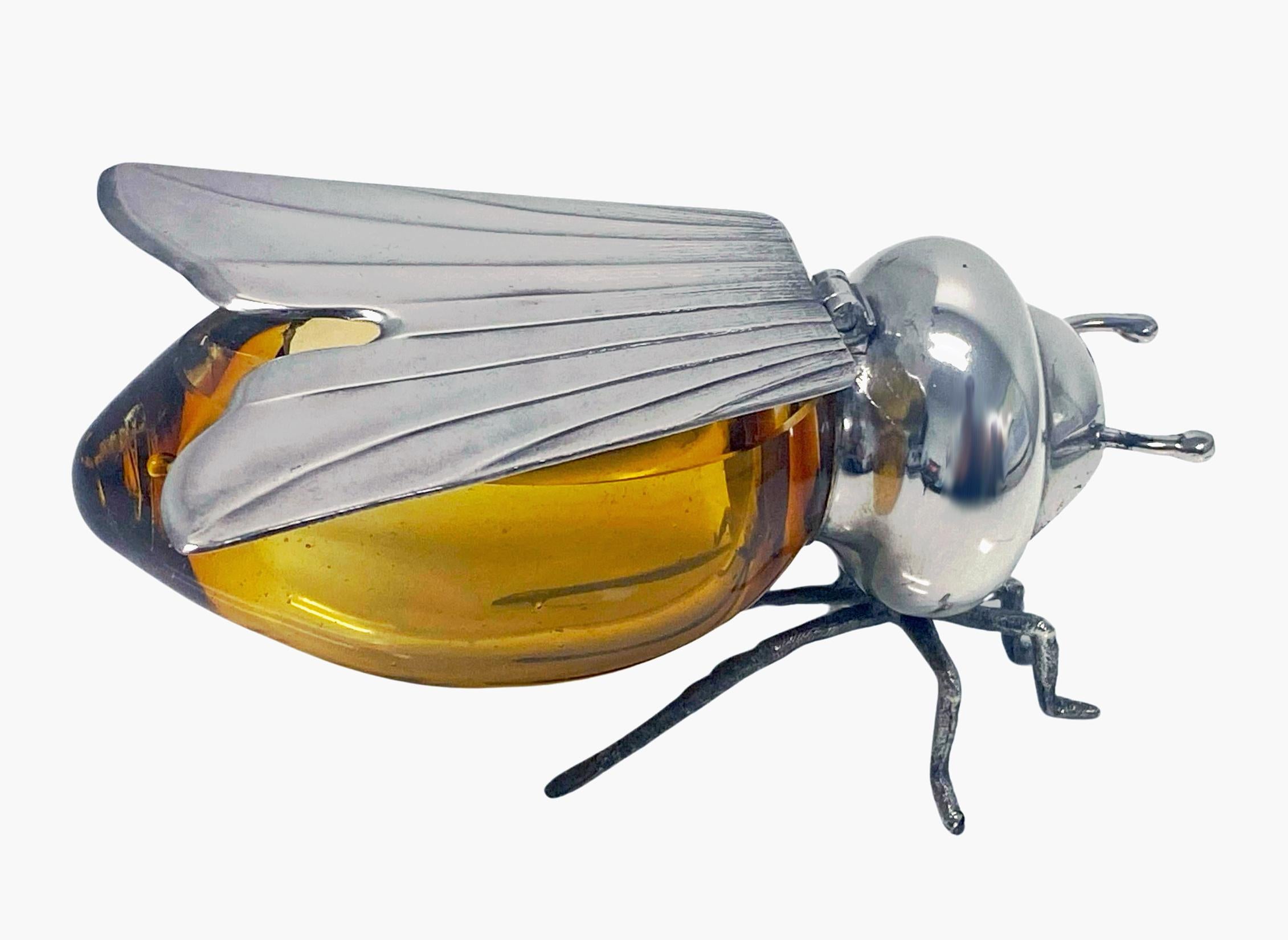 Sterling Silver and amber colour glass figural Bee Honey Pot, Camusso Peru C.1930. The honey pot with hinged wings and amber glass body conforming in shape, protruding antennae on six realistically textured legs attached to the thorax. Measures: 3.5