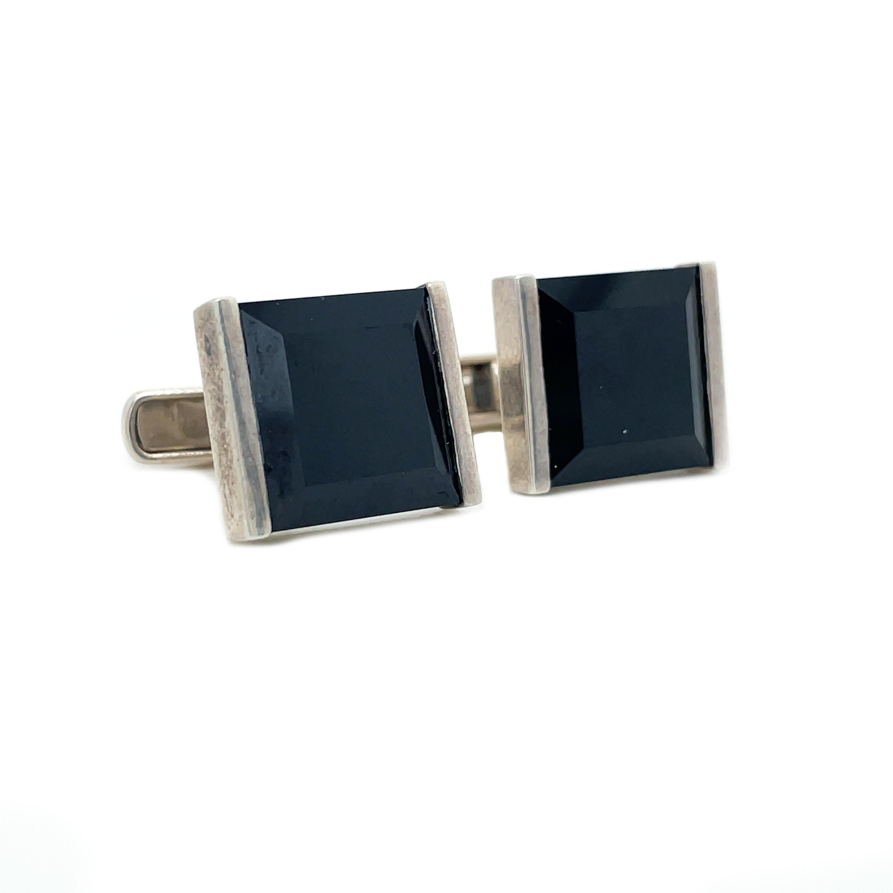 This is a killer set of sterling silver cufflinks that showcases a beautiful contrasting black onyx on the face! This is a timeless and classic pair of links that are essential to any gentleman's collection! This set of cufflinks would look