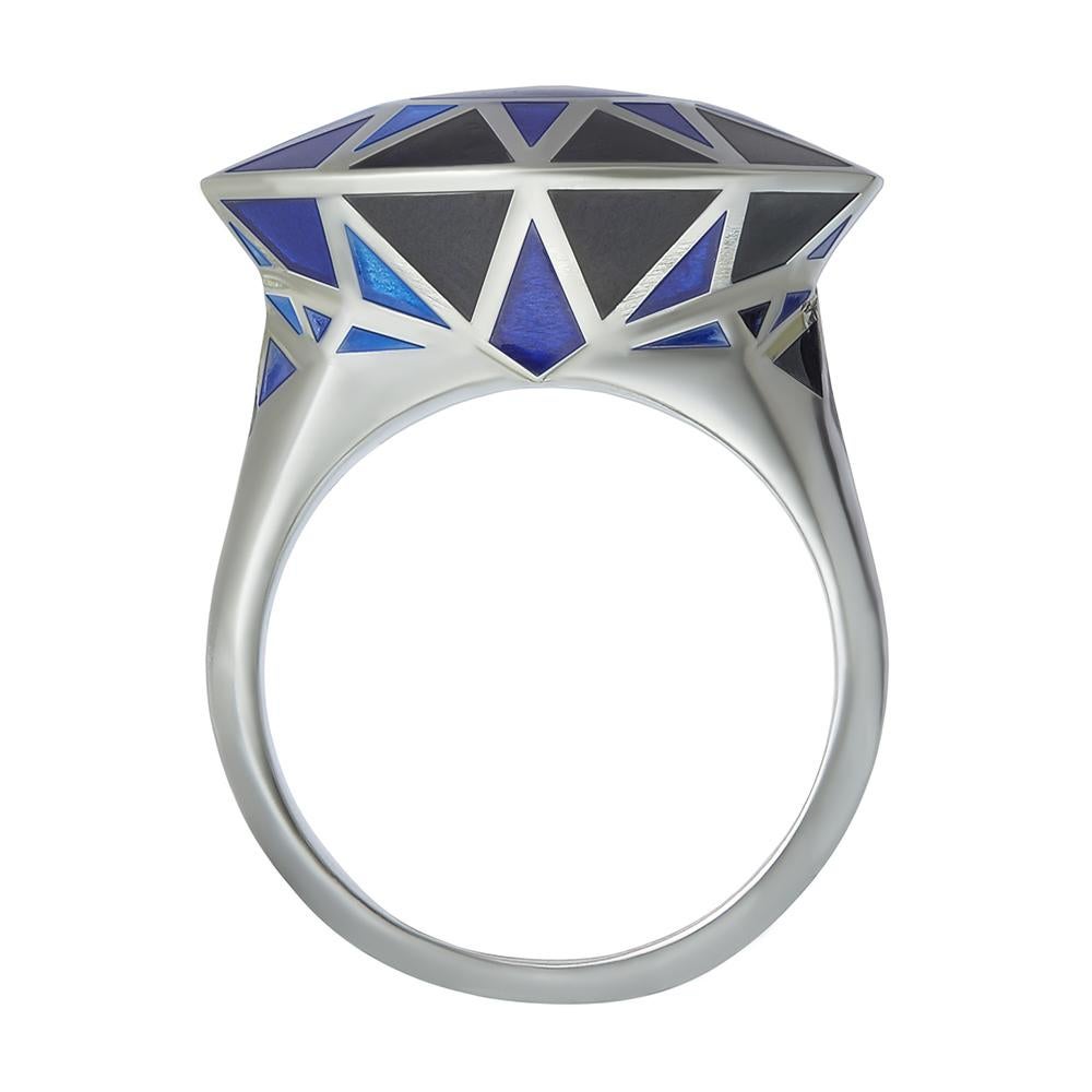 Sterling silver and blue enamel cocktail ring
Hallmarked
Adapted to any ring size

Inspired by the notion of illusion and trickery, this statement cocktail ring in sterling silver is finished in hand-painted blue enamel, mimicking the form of a high