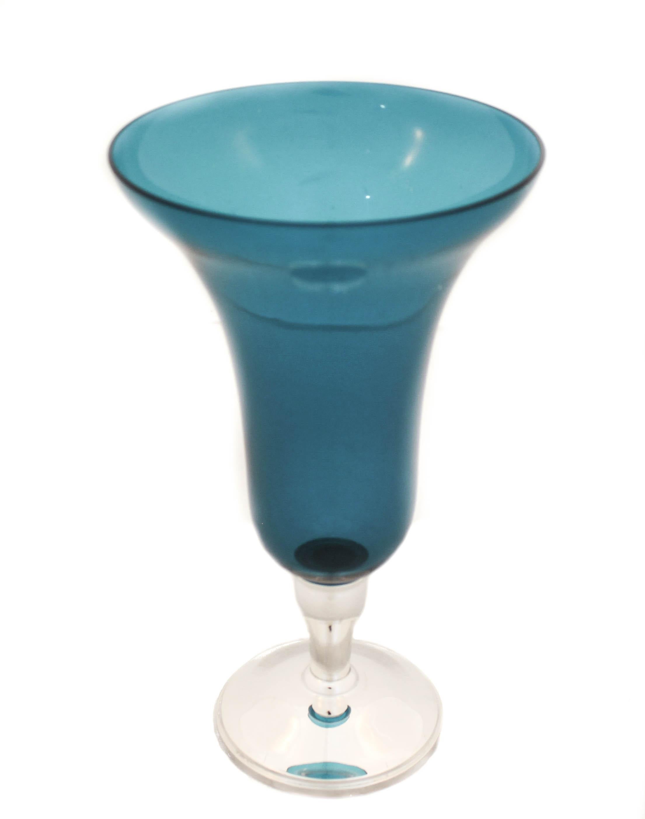 Being offered is a rare sterling silver vase with teal colored crystal.  Manufactured by Gorham Silversmiths of Providence, Rhode Island it has a MidCentury modern design.  Especially the teal colored crystal and the simplicity of its appearance. 