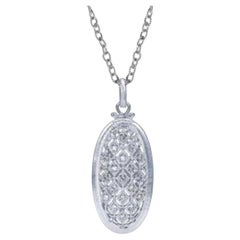 Vintage Sterling Silver and Diamonds Oval Filigree Pendant