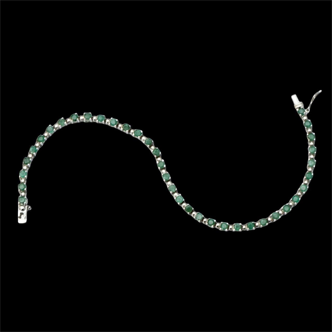 Sterling Silver and Emerald Tennis Bracelet circa 1980s For Sale 4