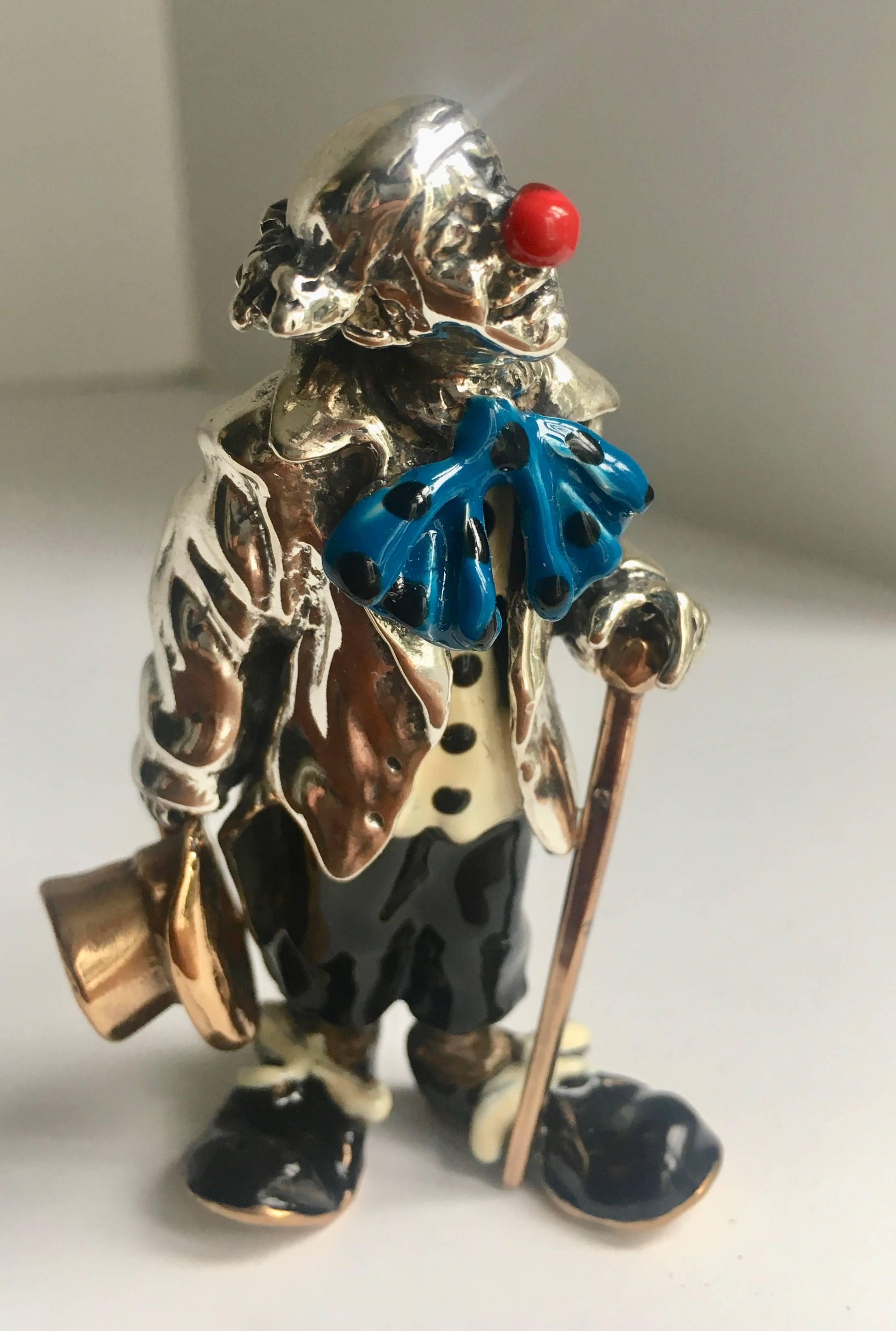 Sterling silver and enamel clown figure - reminiscent of the Tiffany sterling figures and likely by the same artist, Gene Moore - Marked 925 on leg 

This is a lovely piece for a children's shelf, office or desk.