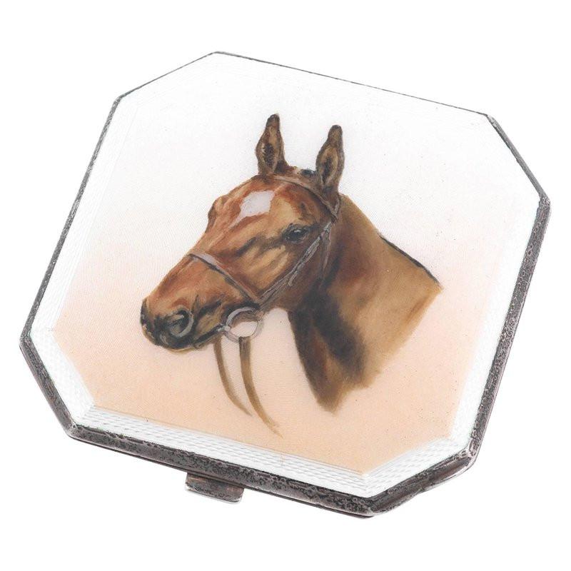 Elizabeth II English sterling silver and enamel mirror compact, an addition to our ornamental equestrian silverware collection. The subtly convex anterior surface is embellished with an exceptional enamel panel depicting the portrait of a horse