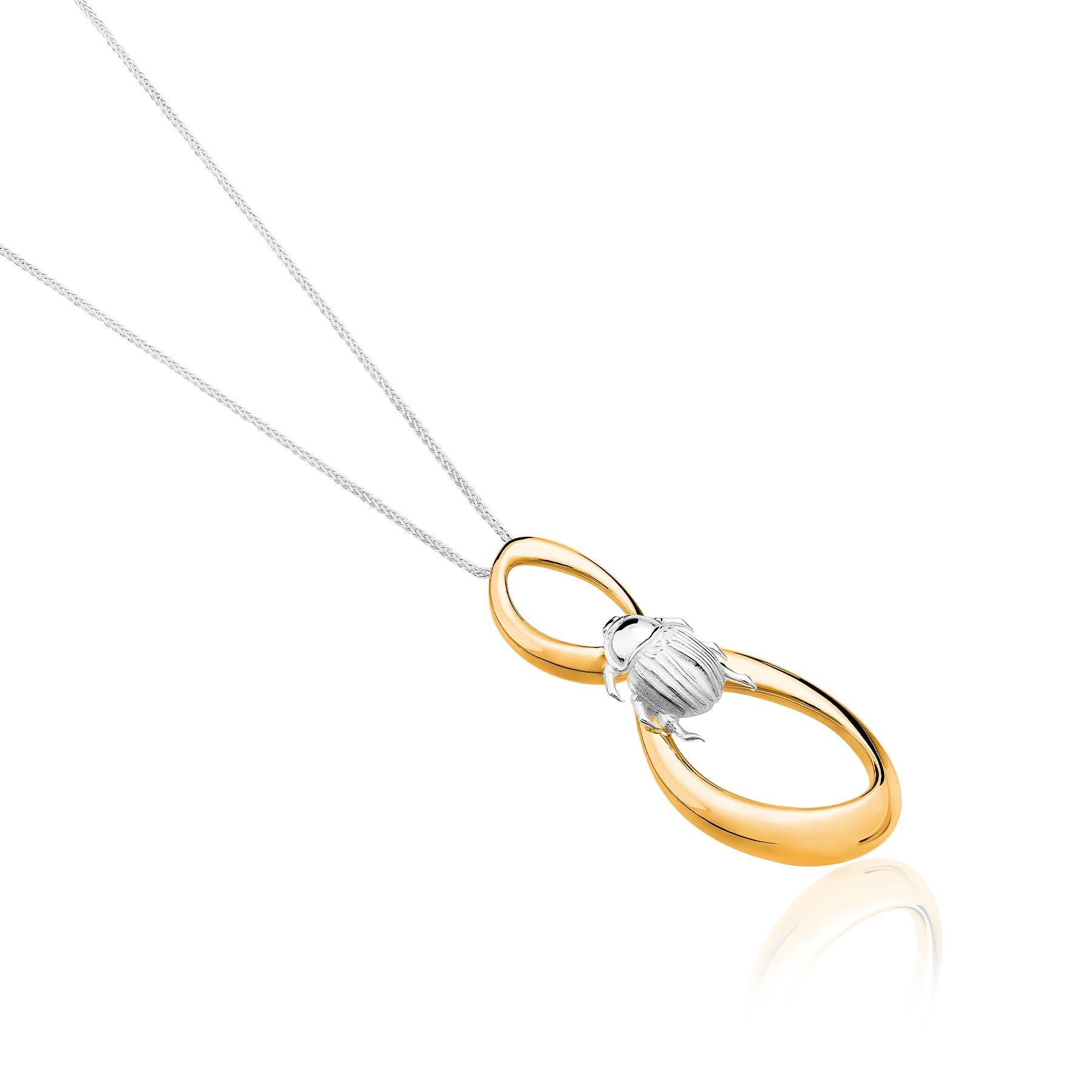 The Beetle Vermeil Pendant from the Animales Collection by TANE is made in sterling silver. Suspended from a chain of 31.4”, there are a pair of irregular links designed for the collection, inspired by nature, finished in yellow gold vermeil. These