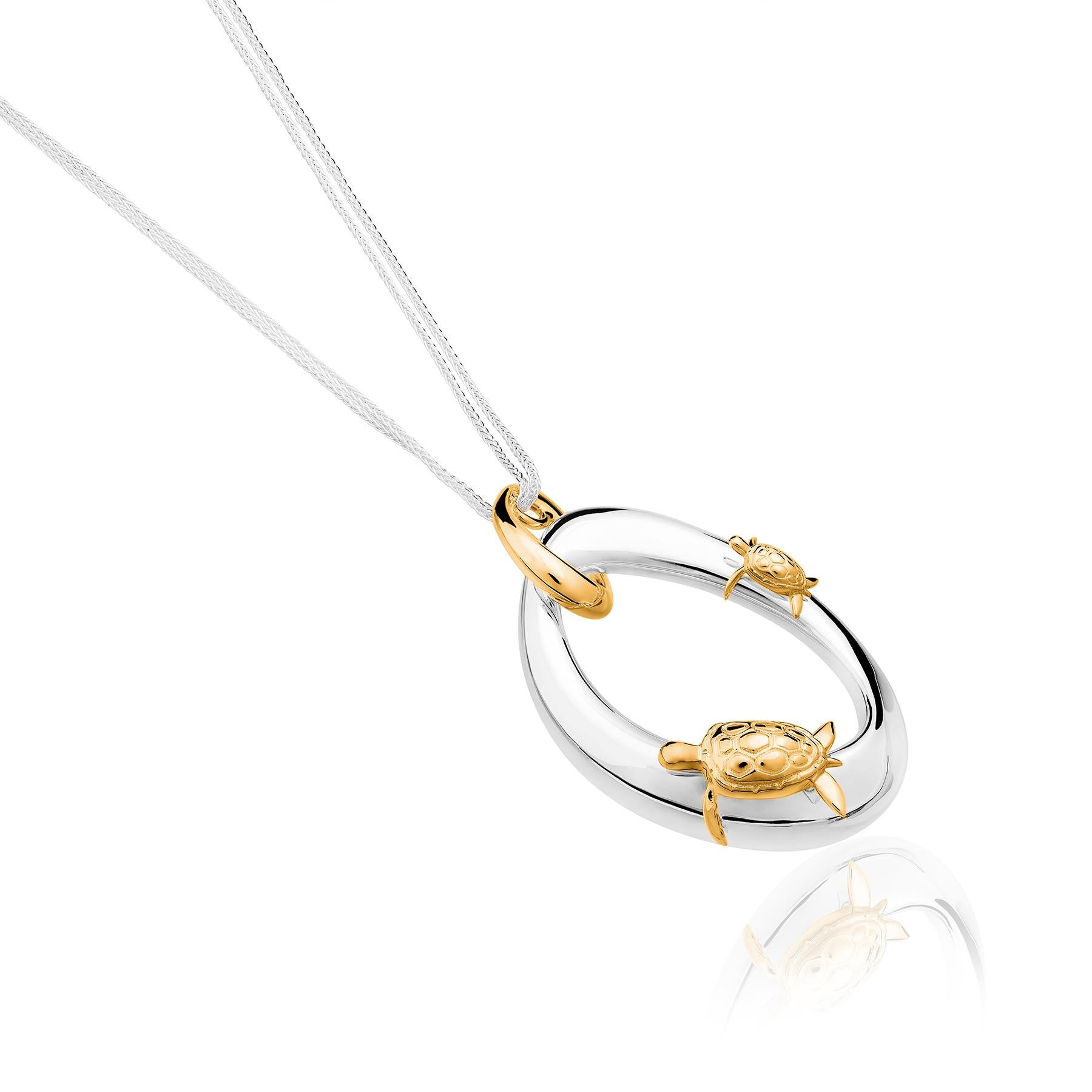 The Turtle Vermeil Pendant from the Animales Collection by TANE is made in sterling silver. Suspended from a chain of 31.4” there is an irregular link designed for the collection, inspired by nature. Two turtles finished in 23 karat yellow gold