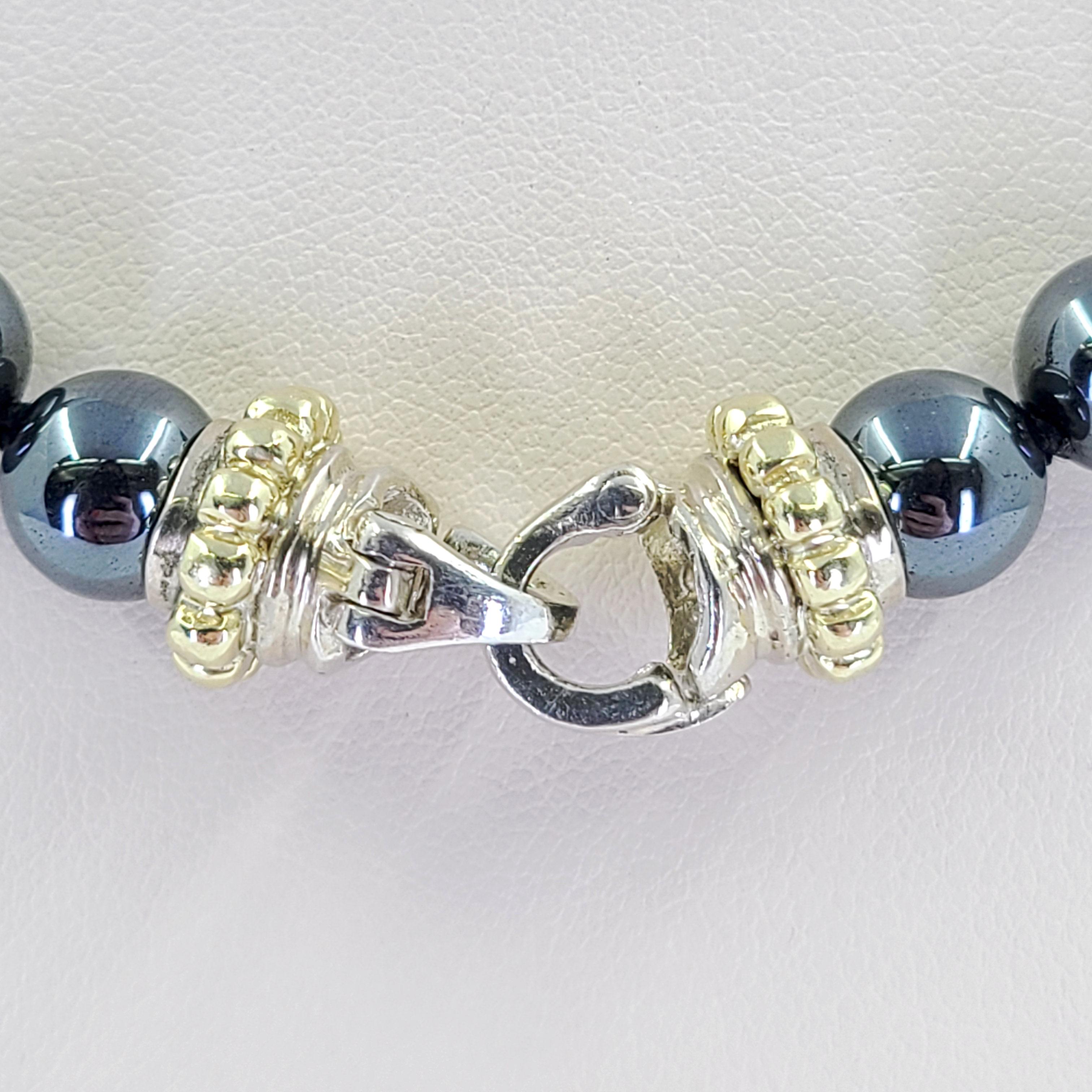 8mm Hematite Bead Necklace Measuring 16 Inches Long Featuring Sterling Silver Clasp With 9 Karat Yellow Gold Accents. Each End Opens And Closes, So You Can Change Out Multiple Pendants.