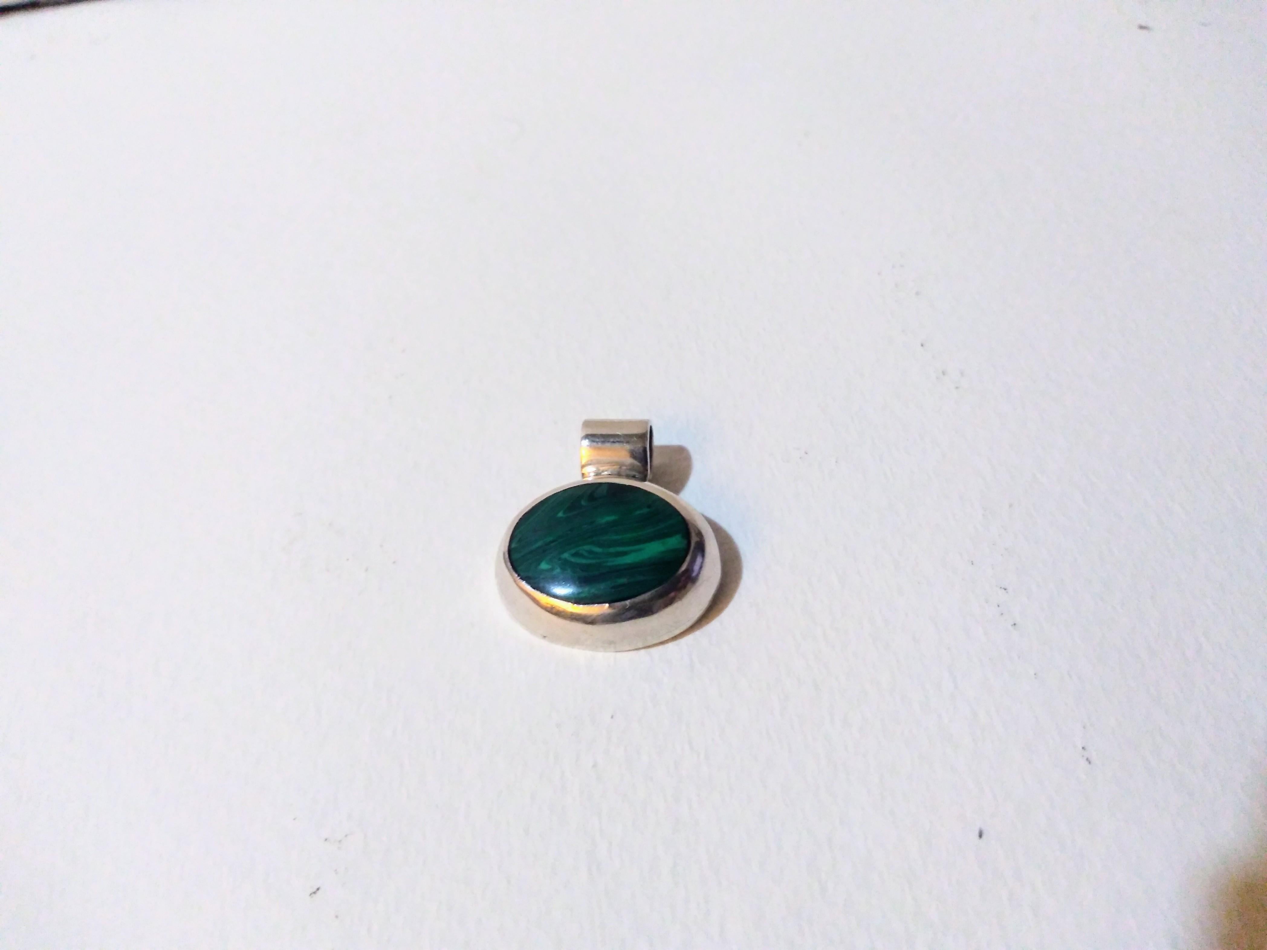 This is a piece of craftsmanship. This pendant is crafted in sterling silver and has a beautiful malachite setting.


Ready to wear.