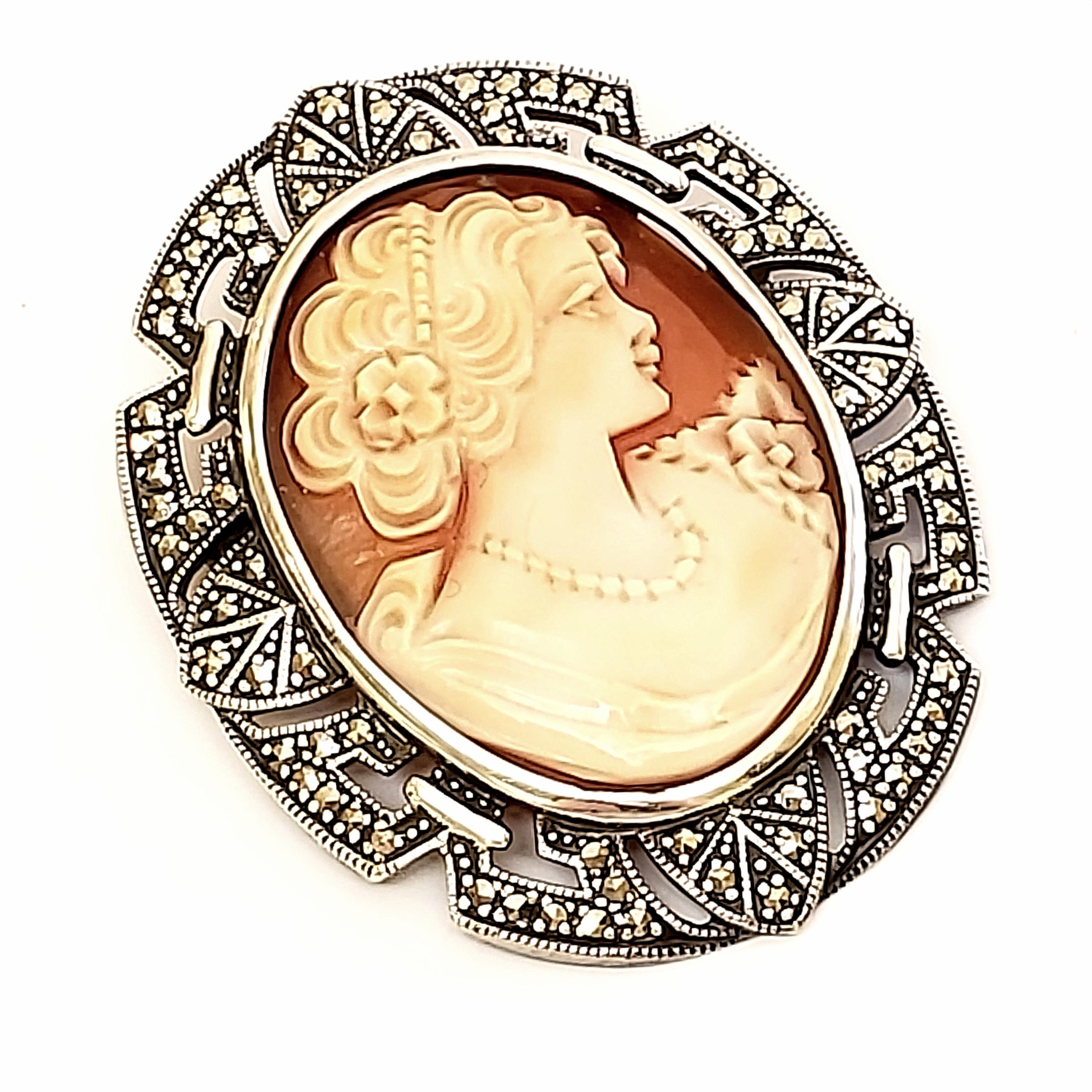 Sterling silver and marcasite cameo pin and pendant.

This beautiful cameo features a lady's portrait in a marcasite sterling silver frame. Can be worn as a pin or pendant.

Measures 1 11/16