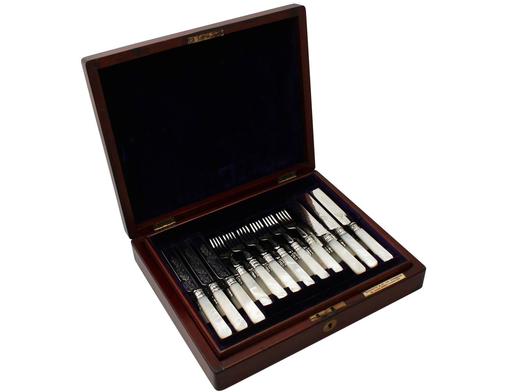 An exceptional, fine and impressive antique Edwardian English sterling silver and mother of pearl fruit/dessert cutlery set for 12 persons, boxed, an addition to our dining silverware collection.

This exceptional antique Edwardian sterling silver