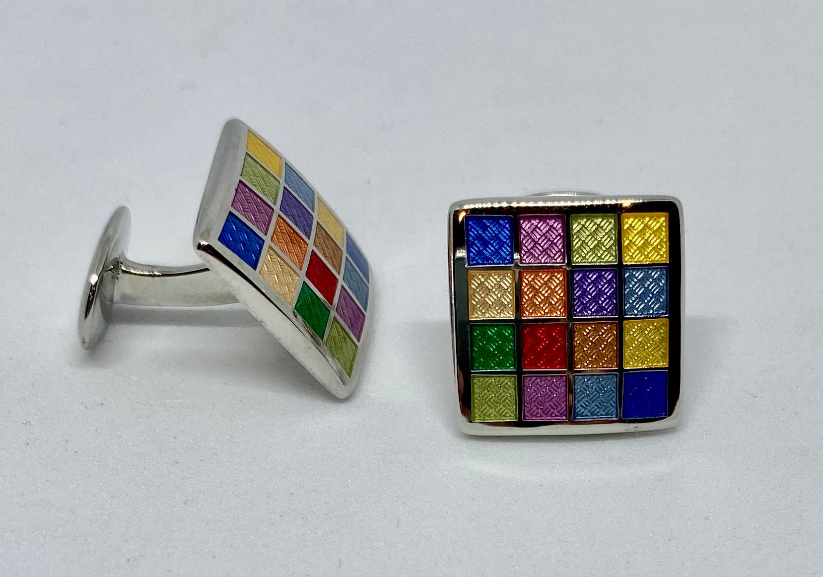 A colorful pair of cufflinks featuring enamel on solid sterling silver.

The faces measure 16.6mm square and feature a range of brightly colored enamel squares upon sterling silver. Together the cufflinks weigh 13.63 grams.

The cufflinks are