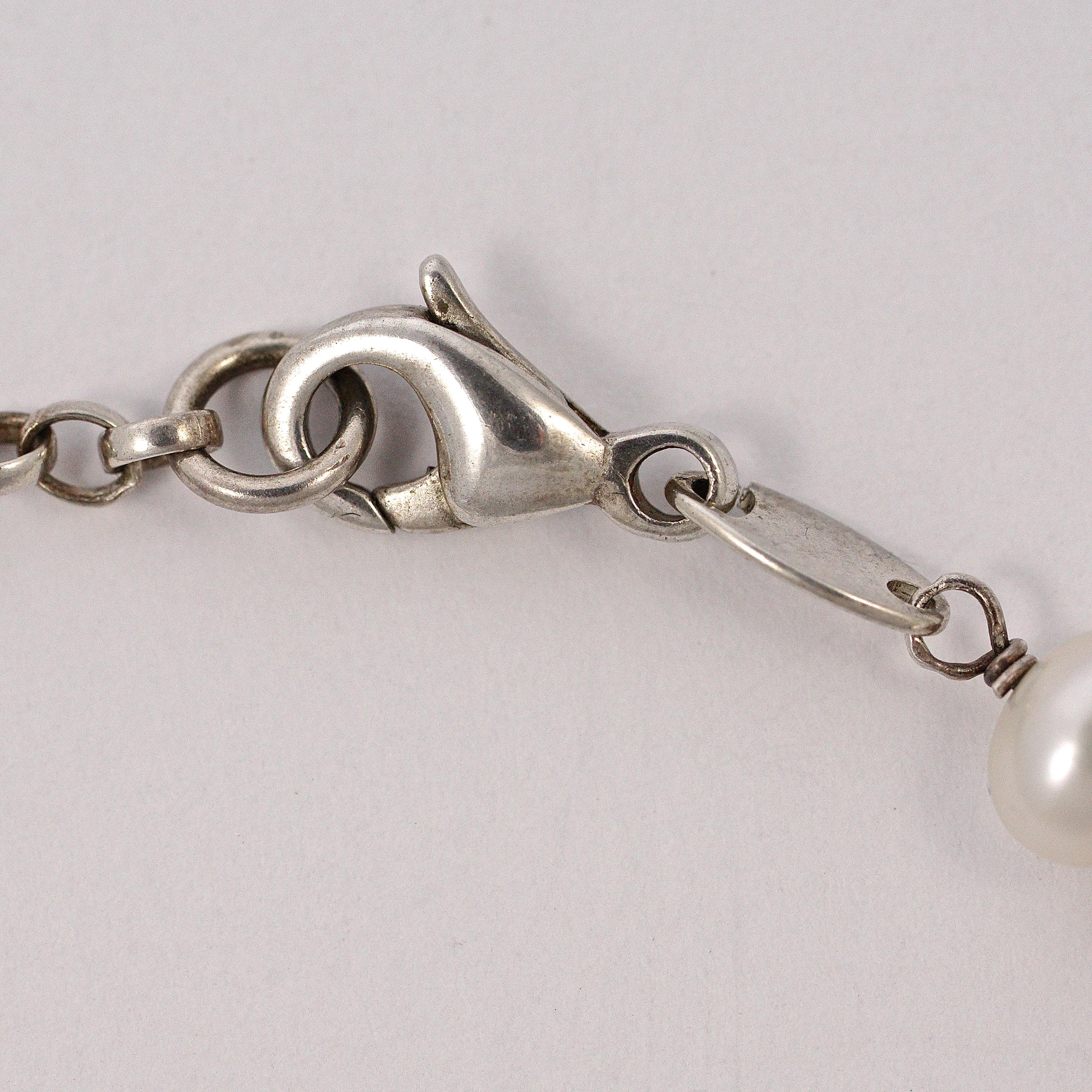 Sterling Silver and Oval Freshwater Pearl Swallow Bracelet  In Good Condition In London, GB