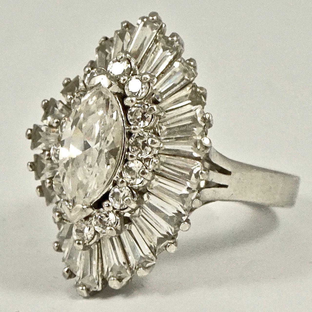 Stunning sterling silver cocktail ring, set with beautiful baguette and round rhinestones, and a centre marquise rhinestone. Ring size UK P 1/2,  US 7 3/4, inside diameter 1.9cm. Measuring length 2.8cm / 1.1 inch by width 2cm / .78 inch. The silver