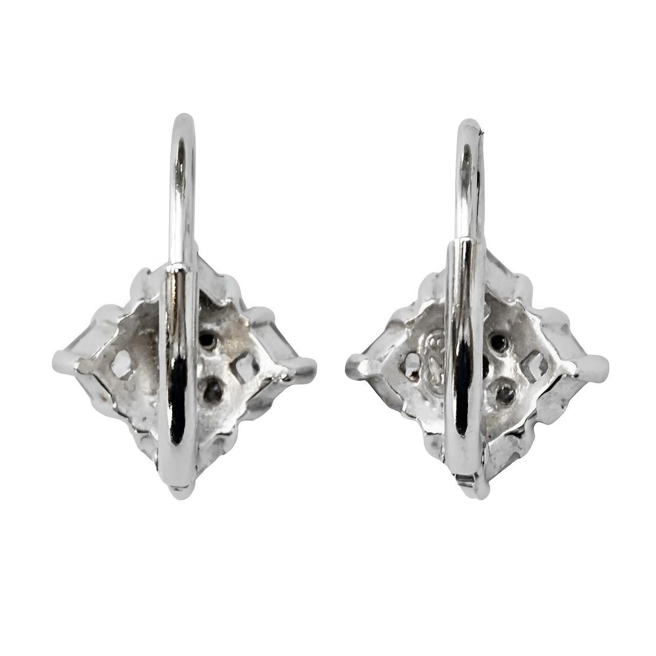 Beautiful sterling silver lever back earrings featuring square and round faceted rhinestones. Measuring 1.2 cm / .47 inch by  1.2 cm / .47 inch not including the fittings.

These are elegant and classic rhinestone earrings to go with many outfits.