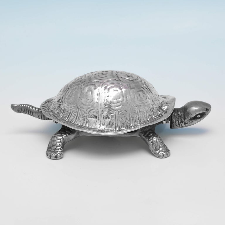 Hallmarked in Chester in 1923 by Grey & Co., this incredibly charming, Sterling Silver Tortoise Bell, has a sterling silver shell and silver plated legs, head, body and tail. The tortoise measures 2