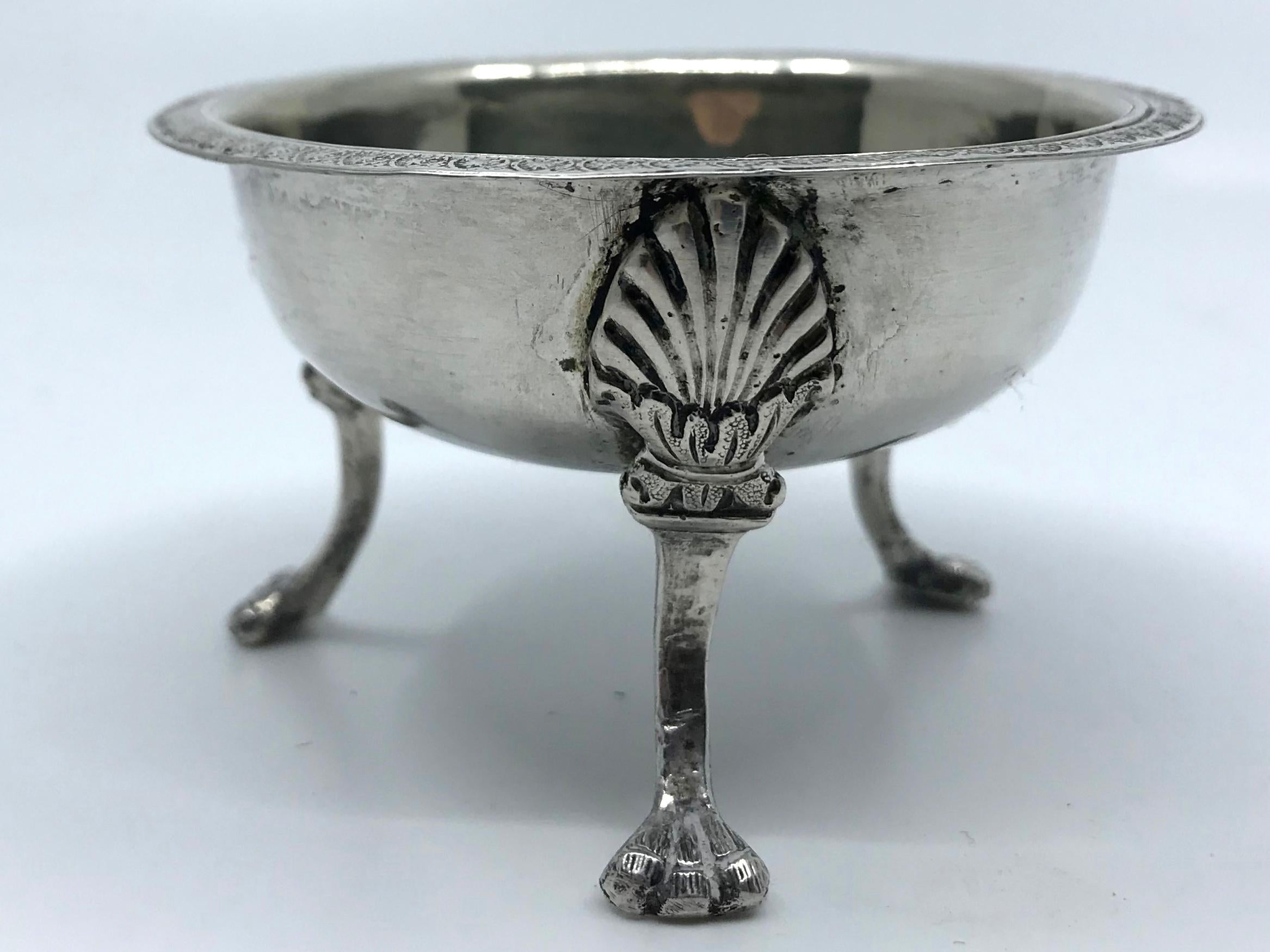 Sterling silver anthemion salt. Neapolitan silver salt / bud vase of circular form with anthemion engraved rim bordering vermeil washed bowl supported on tripartite base capped by anthemion leaves on incurved legs resting on paw feet. Sterling