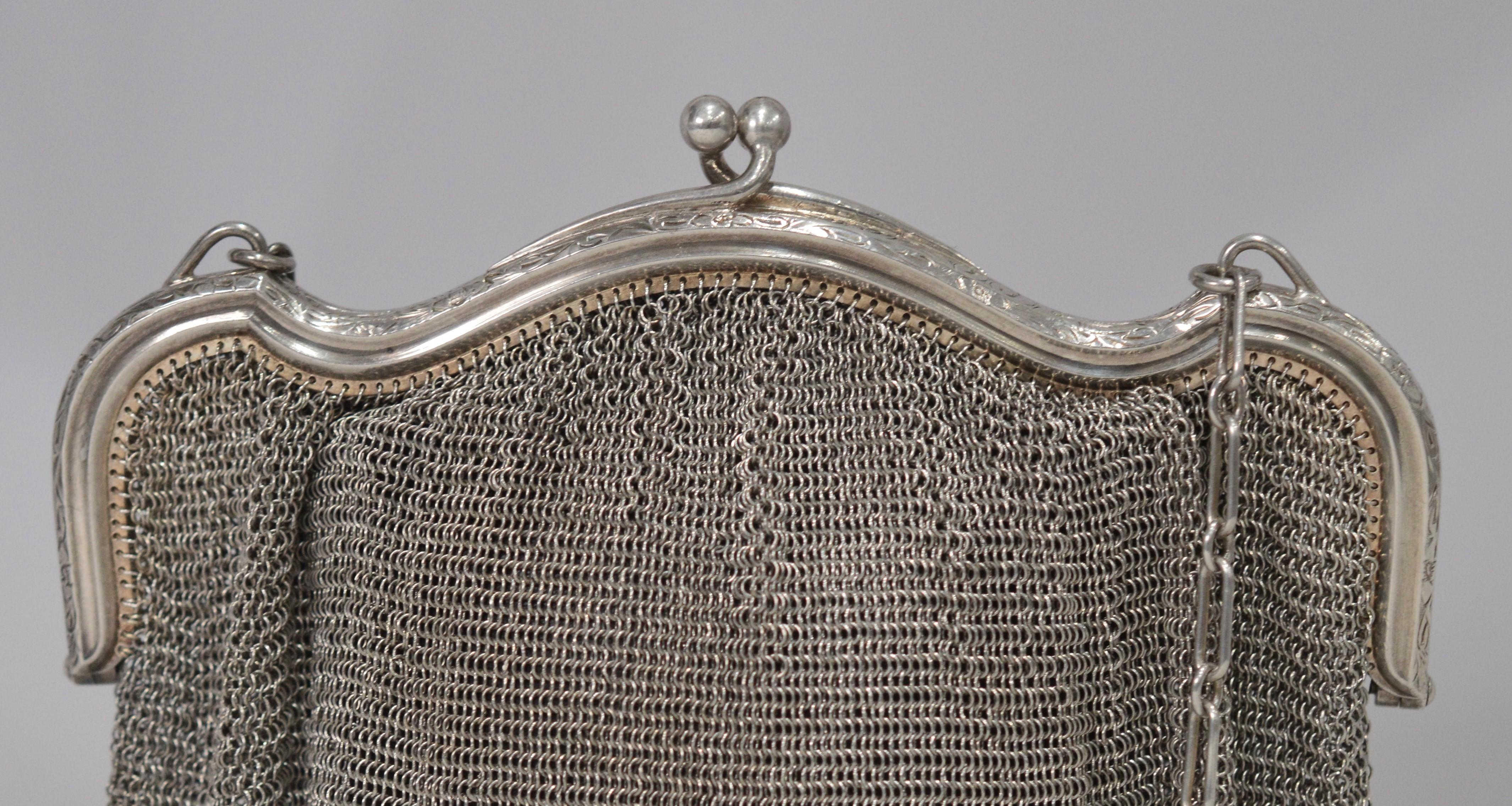 Circa 1900, this Edwardian style sterling silver antique purse by Louis Stern & Co. is a great additional to any personal collection and is a unique evening bag for that special occasion. In excellent usable condition with a beautifully etched
