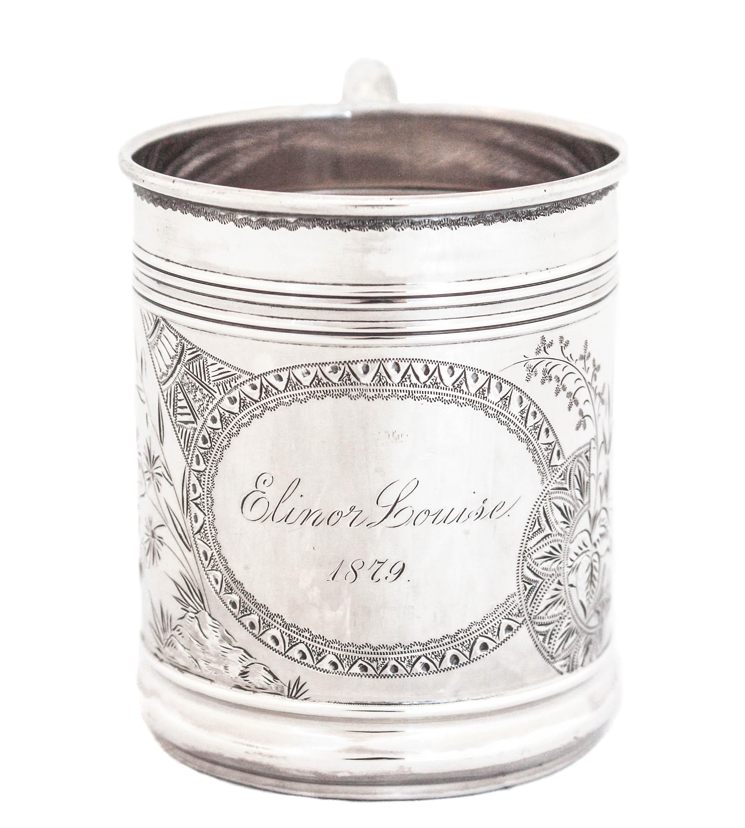 Being offered is a sterling silver mug by J. B. & S. M. Knowles of Providence, Rhode Island.  Engraved “Elinor Louise 1879” in the center of the cartouche it also has leaves and other decorative motifs on each side.  Gifted 144 years ago at the time
