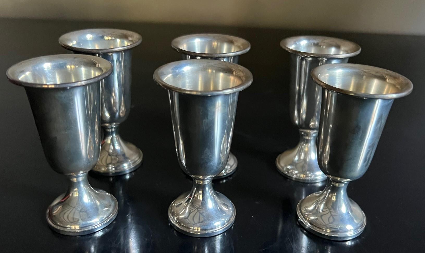 Sterling silver cordial / aperitif cups by Towle. In original box for storage or gifting. Stamped on the bottom towle sterling weighted & reinforced.