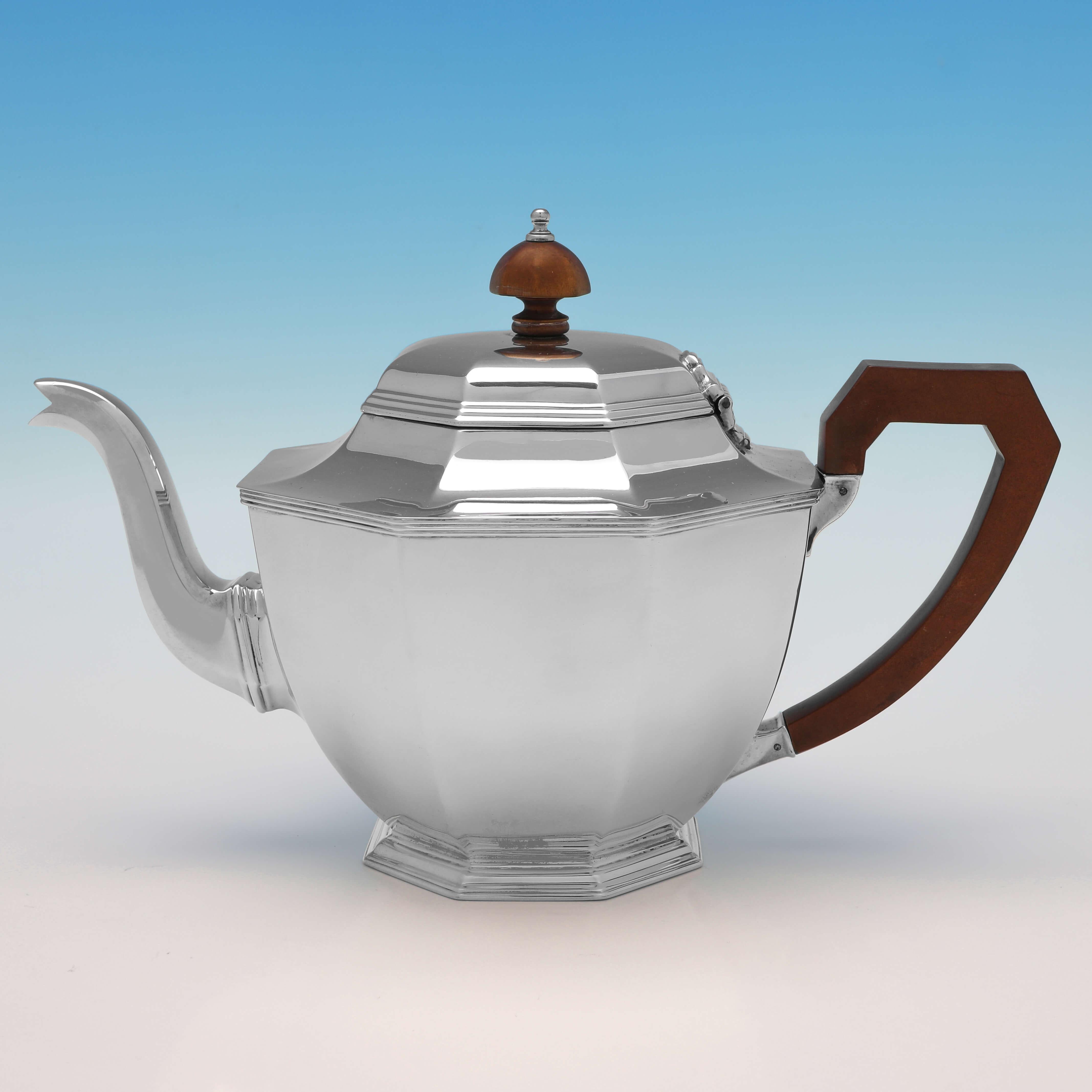 Hallmarked in Birmingham in 1935 by Adie Brothers, this handsome, 4 piece Sterling Silver Tea Set, is in the Art Deco taste and octagonal in shape. The teapot measures 6.25