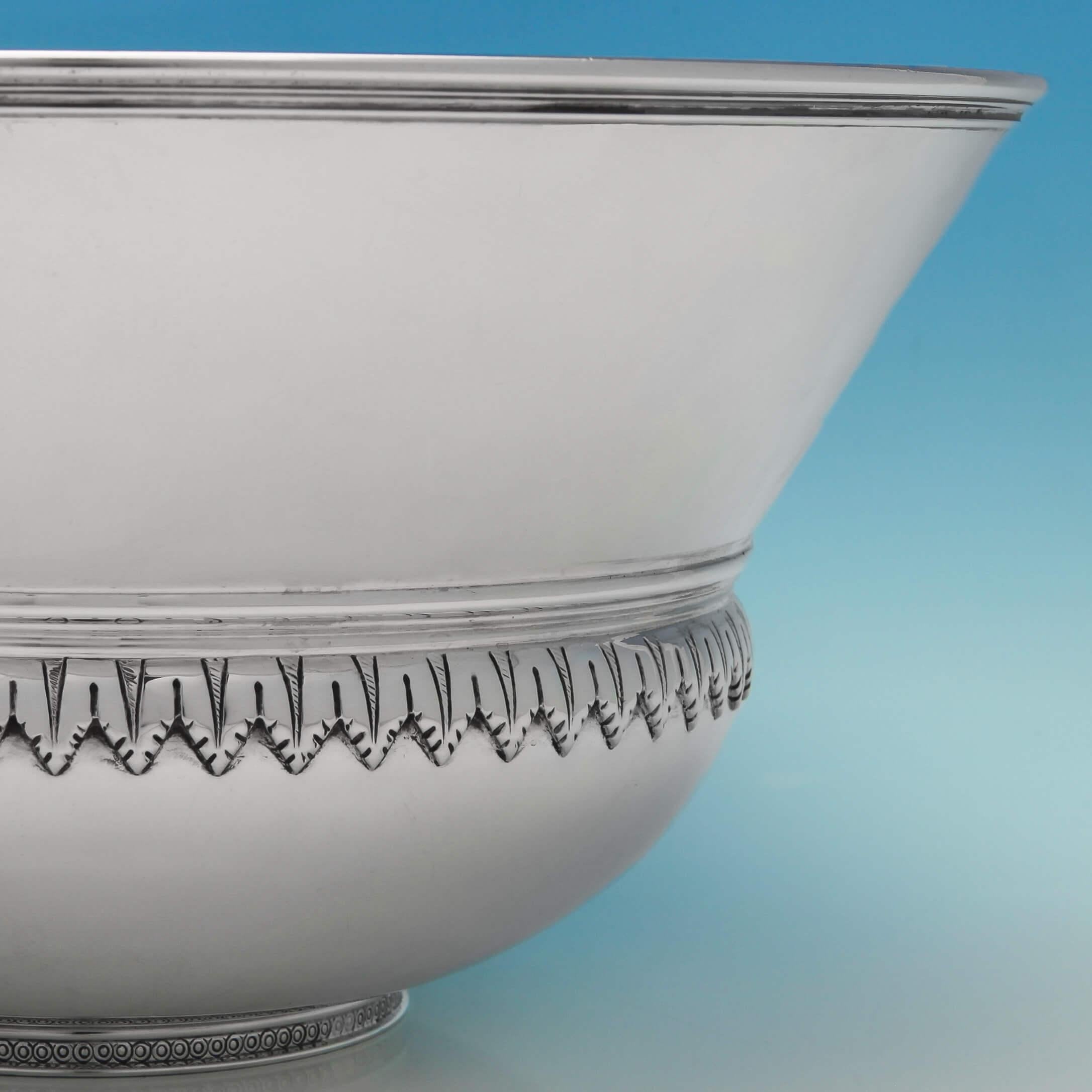 Hallmarked in London in 1936 by Richard Comyns, this fantastic sterling silver bowl is an Art Deco interpretation of the Classic Mazer bowl. Simple and geometric in form, the bowl is decorated with a band of acanthus leaves around the centre and