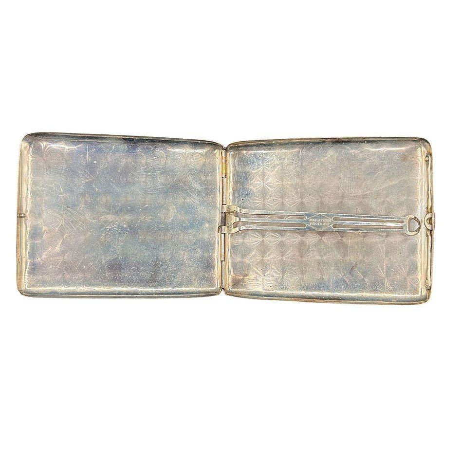 Stunning 1930s Art Deco silver cigarette case with Gold inlay by Marathon, straight out of the golden age of Hollywood! It features gold pin stripes on a silver body with geometric patterns along the face of the case and a smooth polish back, with a