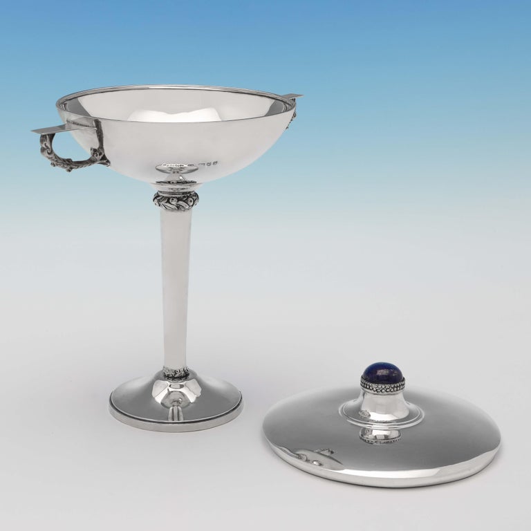 Hallmarked in London in 1939 by Charles Boyton, this striking, Sterling Silver Trophy, shows elements of both Arts & Crafts and Art Deco design, and features a Lapis Lazuli cabochon to the lid. The trophy measures 9.75