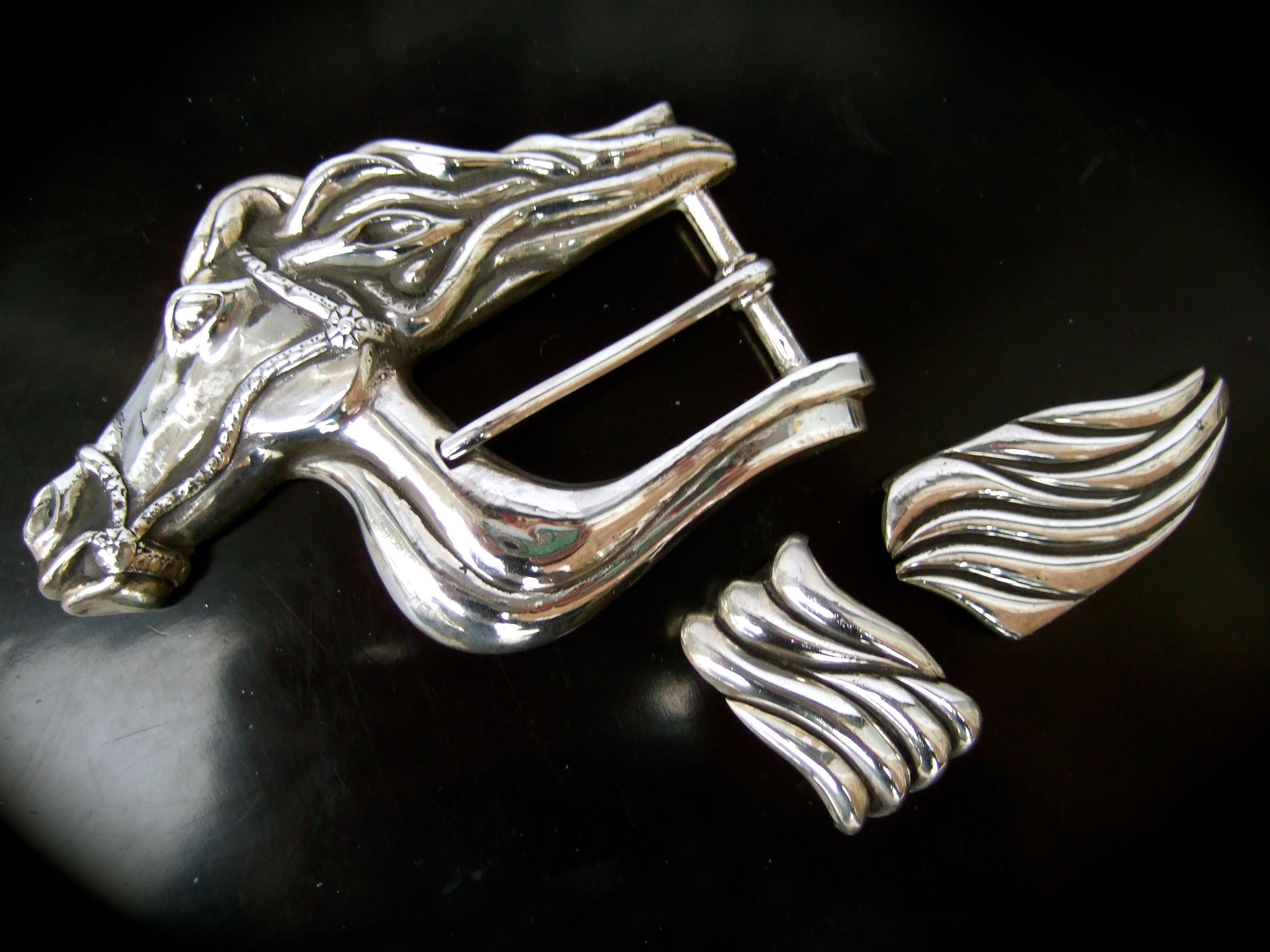 Sterling silver artisan equine belt buckle designed by Big Al c 1995
The unique large scale uni-sex sterling silver buckle 
is designed with a stylized horse head with a sinuous flowing mane 

The sterling buckle is paired with a set of sterling
