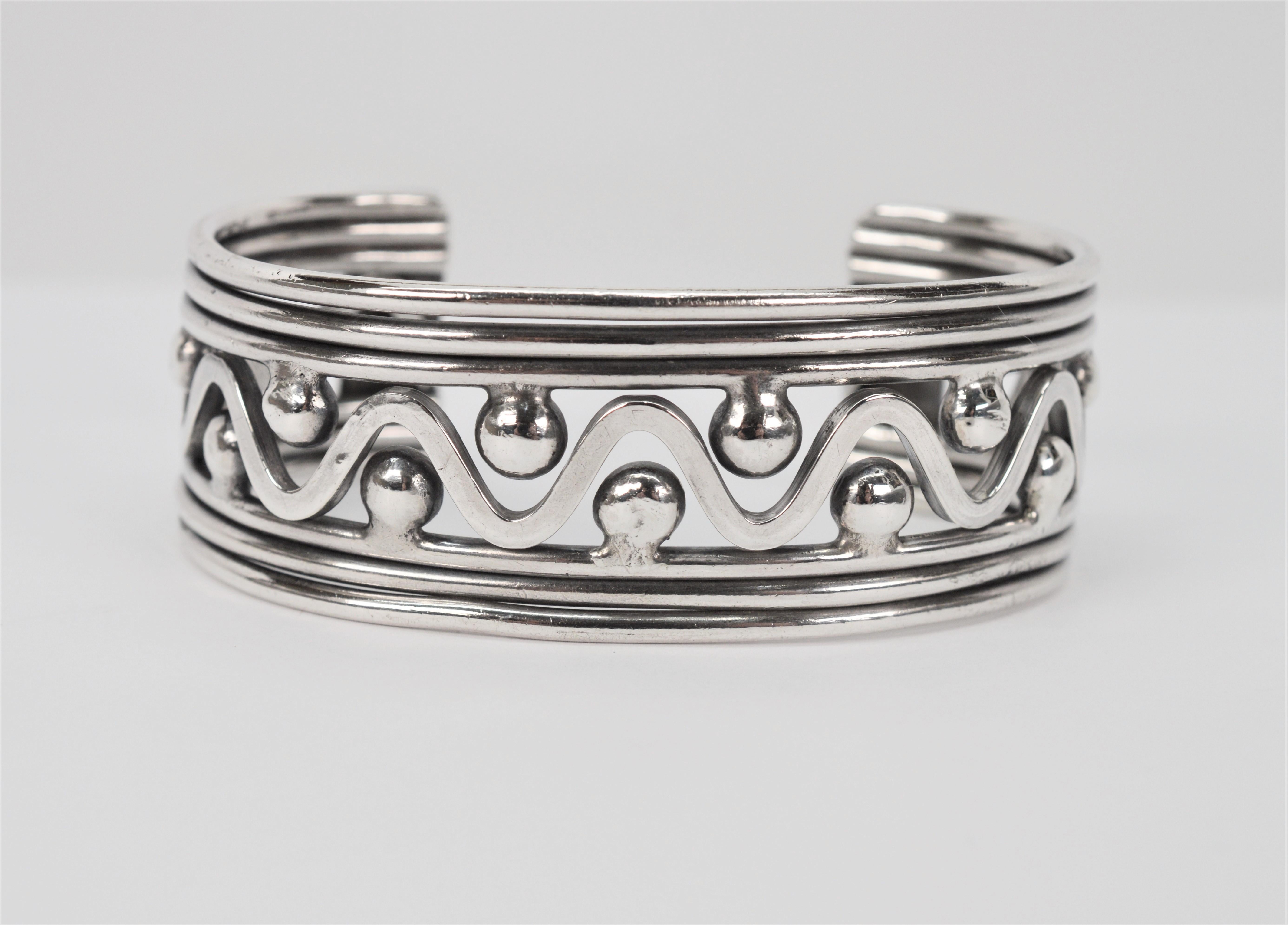 Crafted in .925 sterling silver, this rustic, Artisan made primitive style Sterling Silver Cuff Bracelet brings a bit of whimsy through the simplicity of its geo design. Generous in size, the overall measurement of the piece is 2-5/8 inch. To