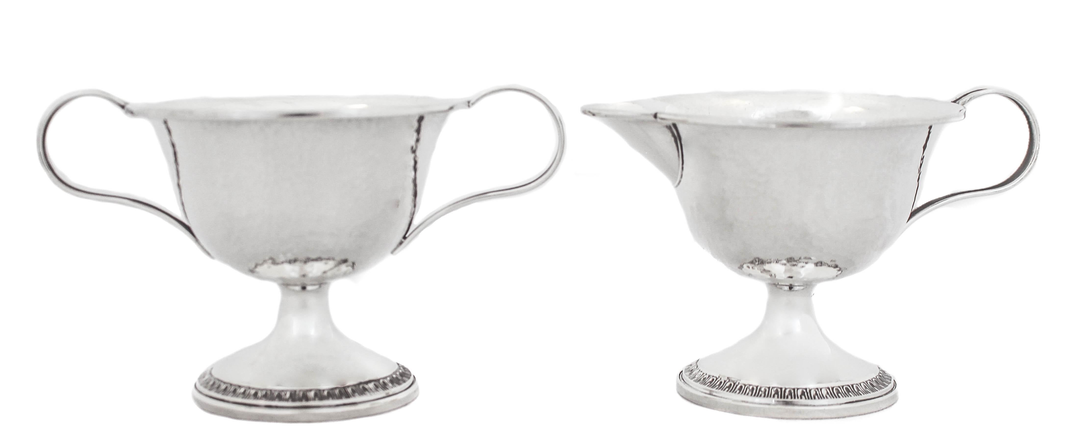 We are thrilled to offer you this sterling silver cream & sugar set in the original box it was presented. Designed by the Webster Silver Company, these pieces have a hand hammered finish and are in the Arts and Crafts style of the early 20th