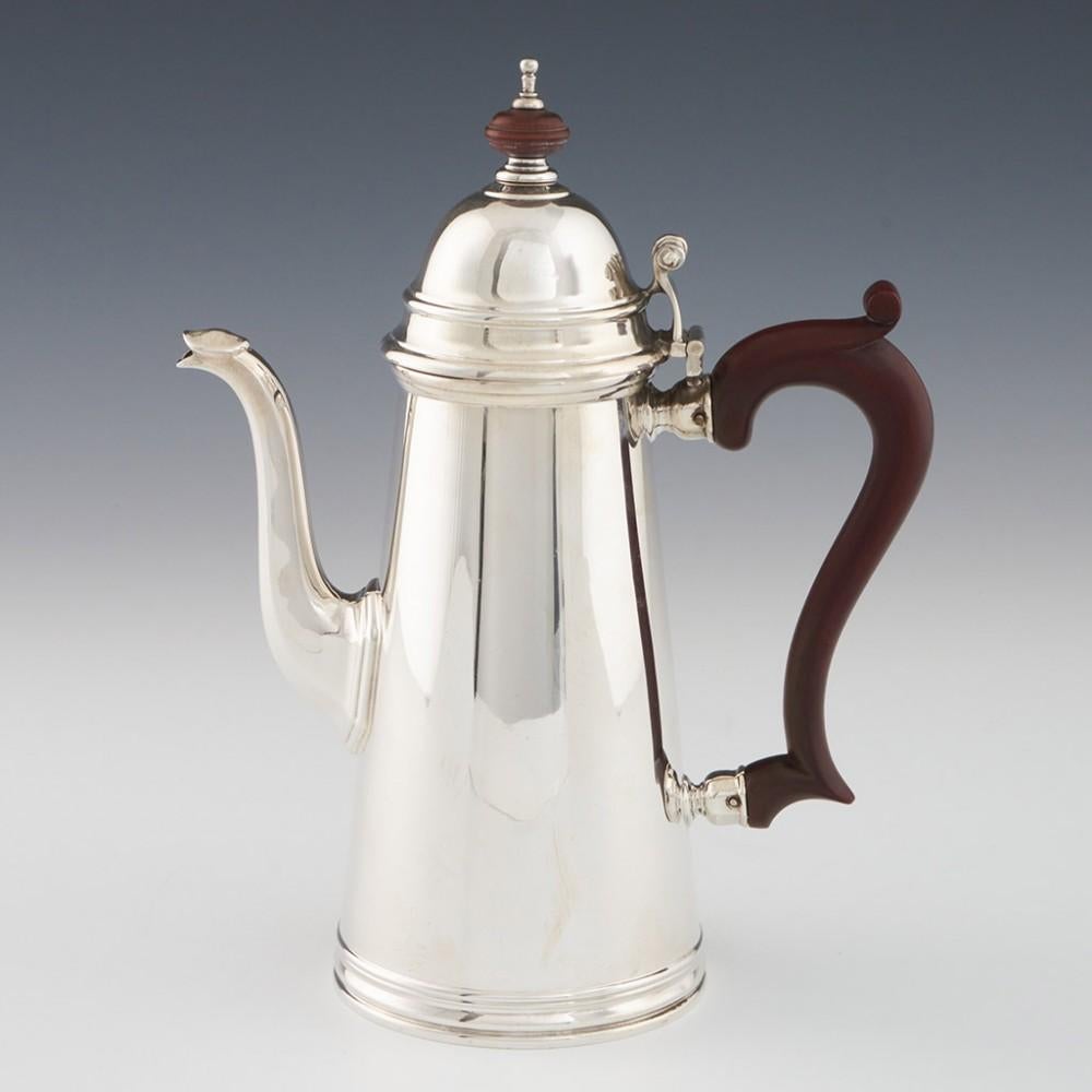 Heading : Asprey Cafe au Lait set
Date : Hallmarked in Birmingham in 1934 and 1939 for Asprey
Period : George V
Origin : Birmingham, England
Decoration : Queen anne style with tapered bodies and terraced feet. Domed covers with stained wood scrolled