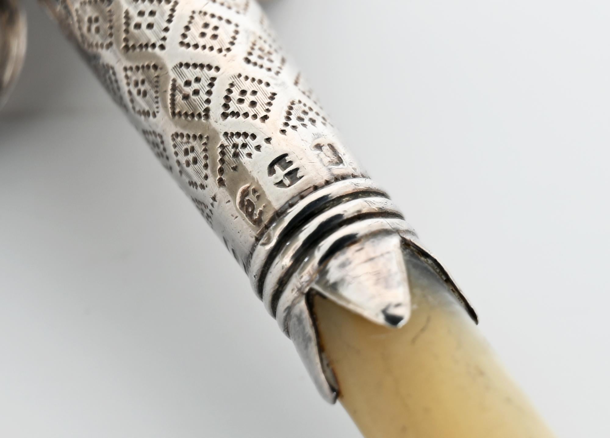 A very charming sterling silver Baby rattle complete with a whistle and real mother of pearl handle. There are six silver bells attached. The rattle is fully hallmarked.
Mm: Joseph Taylor
Birmingham 1818
Sterling silver.
  