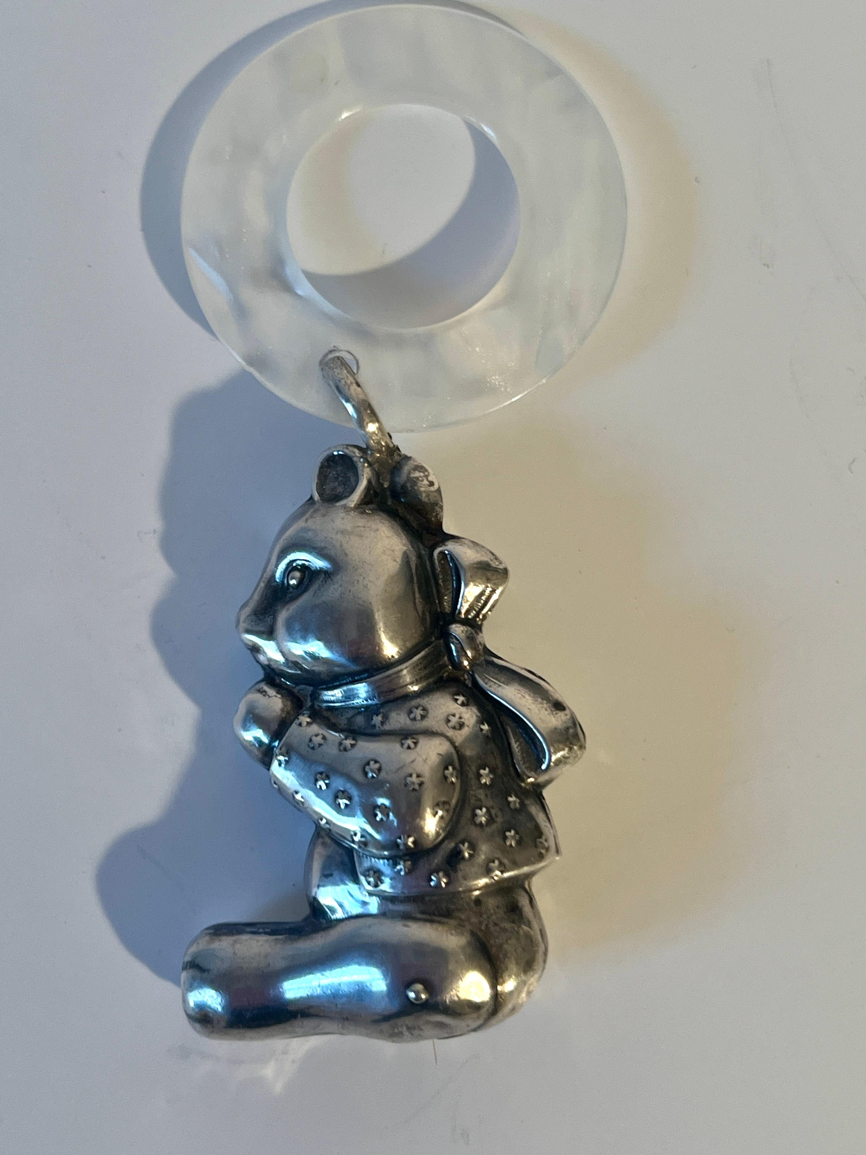 A lovely baby gift or wedding gift.  A sterling silver teddy beat with a wonderful teething ring with a rattler inside the bear.

Could, of course, be practical or as a decorative piece.

A sophisticated addition to any baby room, as a small