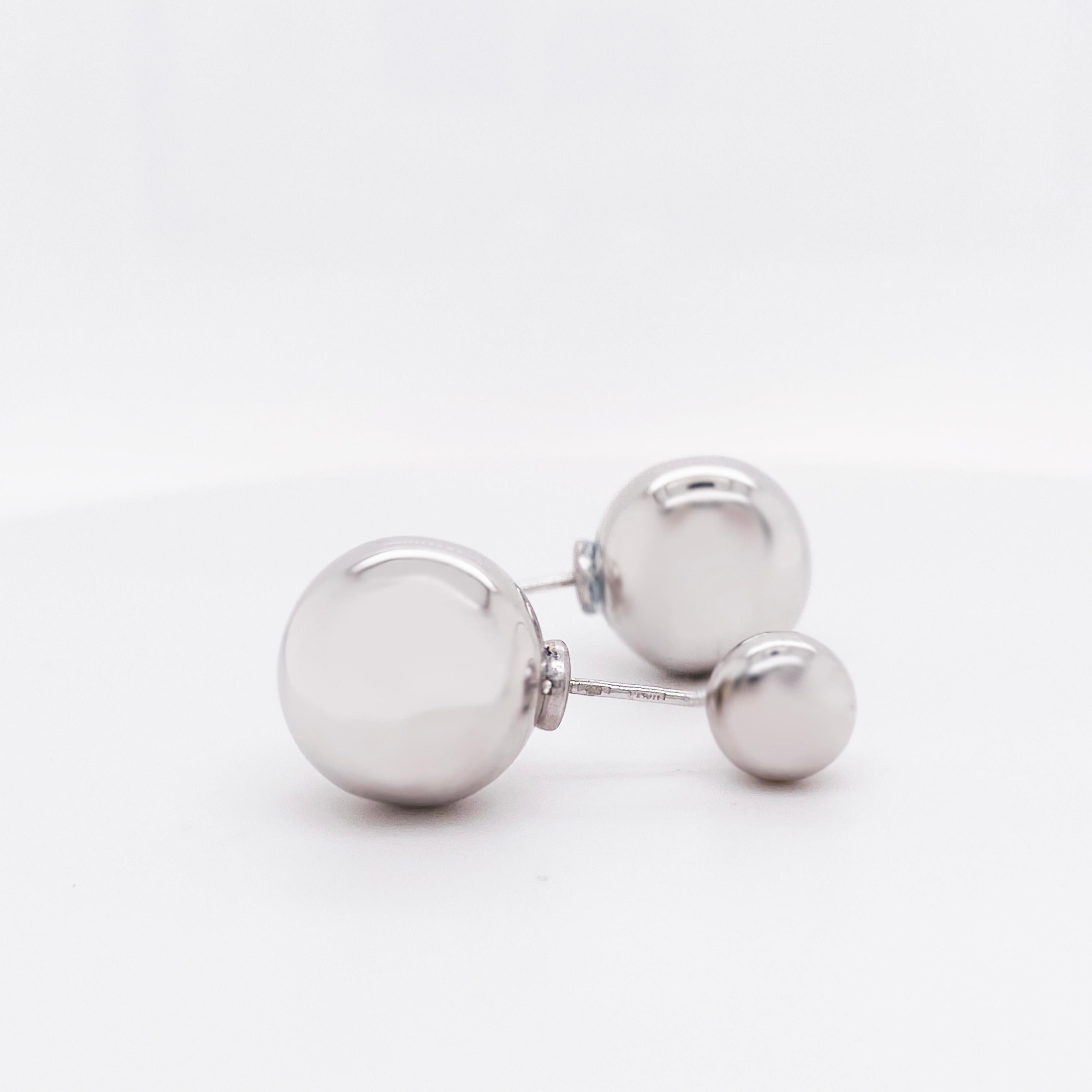 Reversible sterling silver earrings! These sterling silver ball earring studs are high polished, clean and adorable! The earrings have two different sized silver balls that can be worn either way. Wear the smaller size on top for a cute, every day