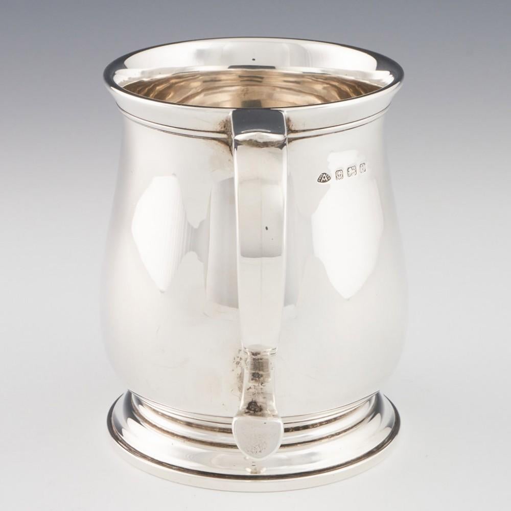 Heading : Sterling silver baluster tankard
Date : Hallmarked in Birmingham in 1934 for Adie Brothers Ltd
Period : George V
Origin : Birmingham, England
Decoration : Terraced foot, baluster body, scrolled handle
Size : 11.5cm height, 14.5cm max