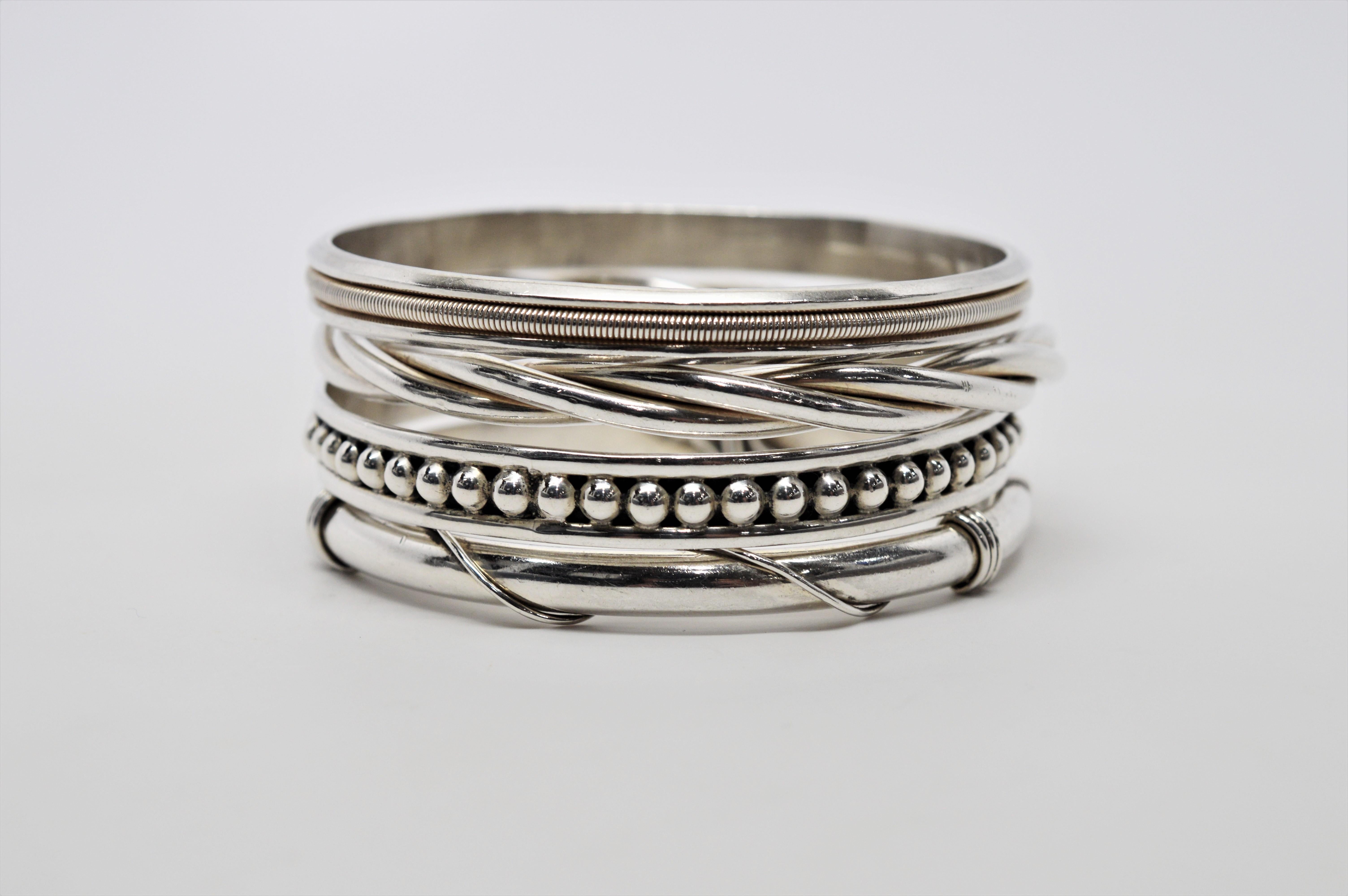 Attention bangle bracelet lovers! Check out this eclectic stack of artisan sterling silver bracelets. Includes a set of four unique but complimenting bracelet styles, measuring 2-3/4 inches in diameter each in slip-on style. So many possibilities!   