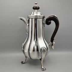 Sterling silver Baroque-style tea and coffee set with a wooden handle