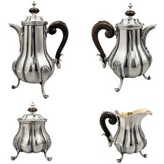 Sterling silver Baroque-style tea and coffee set with a wooden handle
