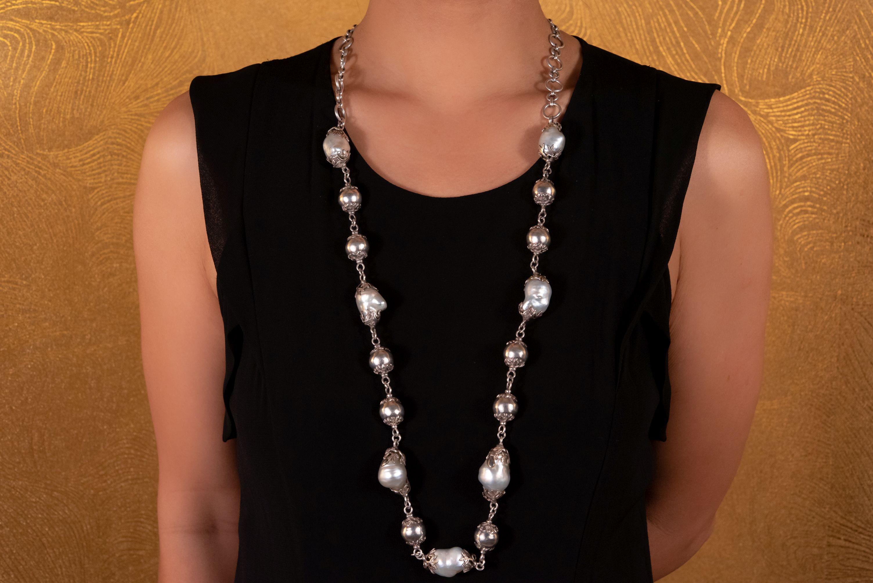 Featuring stunning South Sea baroque silver pearls interspersed with sterling silver beads, this gorgeous necklace delivers unmatched elegance day or night. Set on a generous sterling silver chain, wear it long or wrap it twice for a statement that