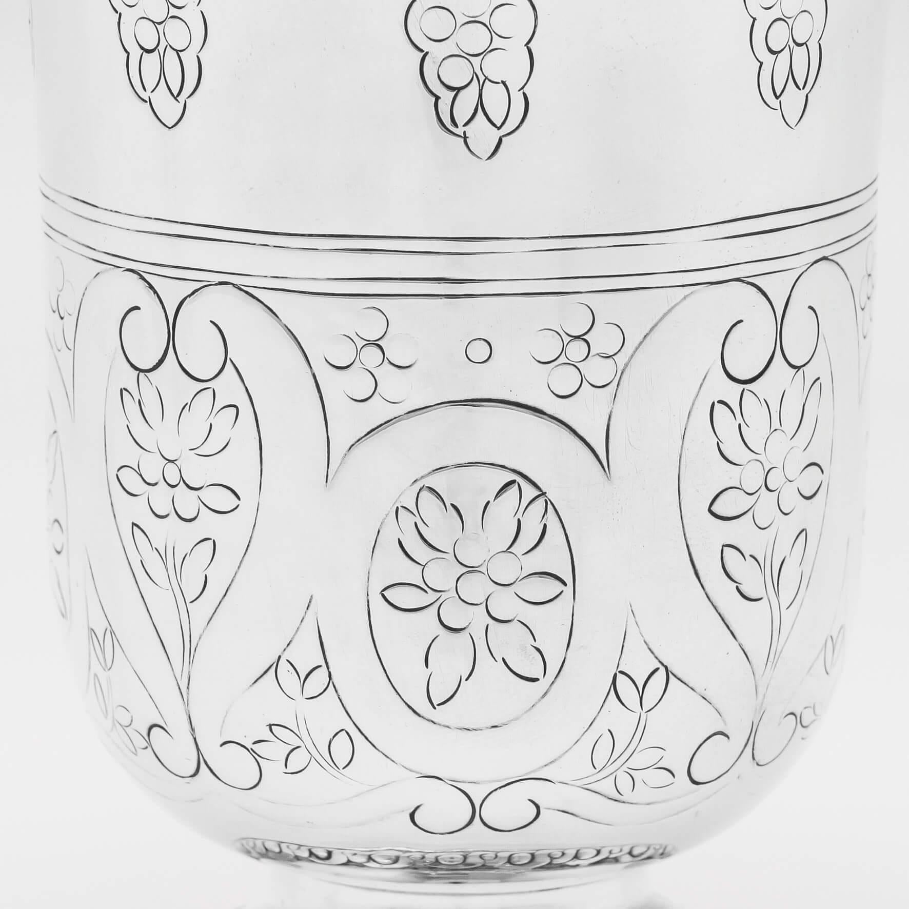 Hallmarked in Birmingham in 1912 by Duchess Millicent Sutherland, and made by the Duchess of Sutherlands Cripples Guild, this attractive, Arts & Crafts Period, George V, antique sterling silver beaker, has floral and scroll flat chasing throughout