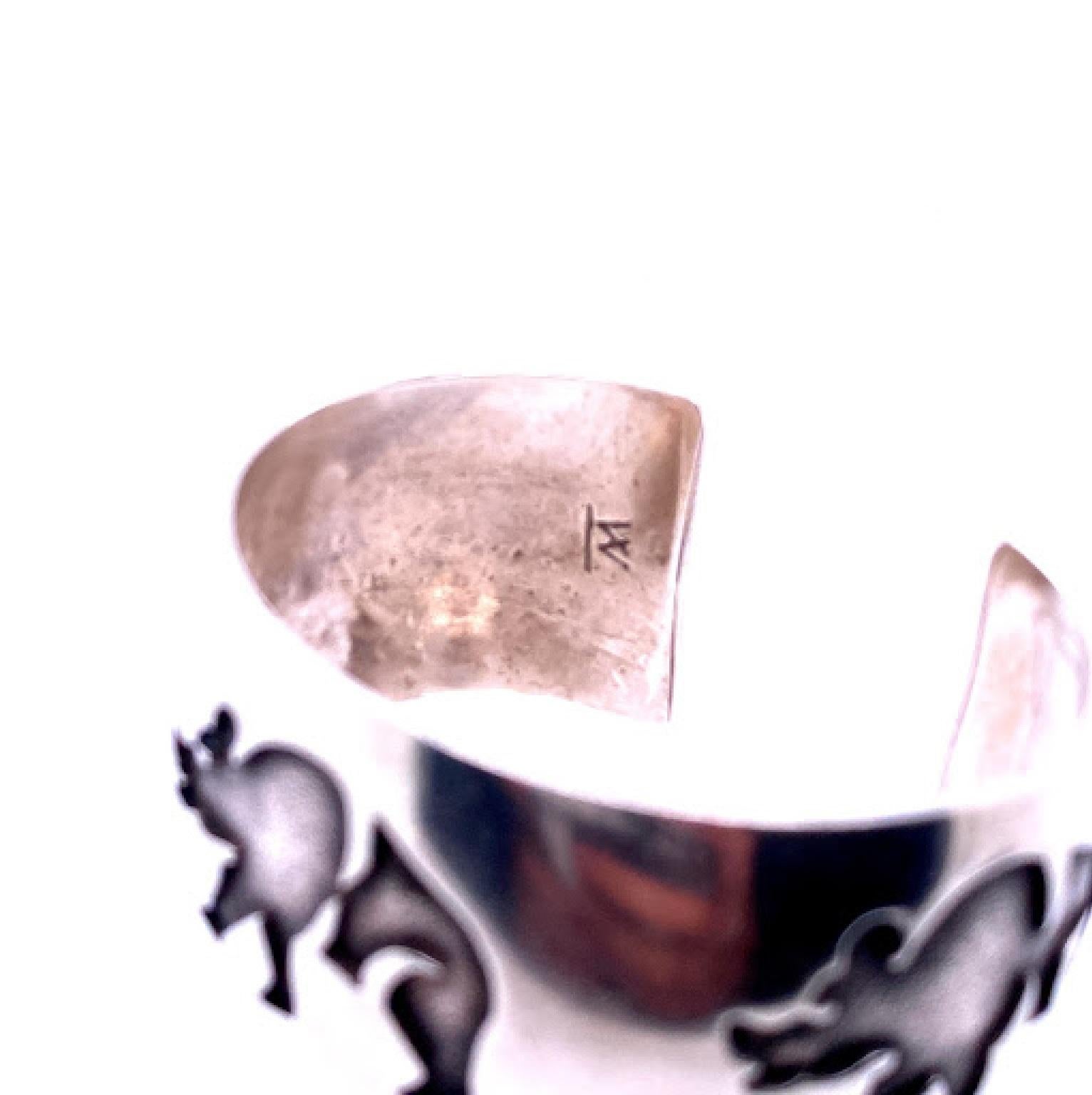 Sterling silver (not stamped) cuff bracelet engraved with bears, measuring 1.25’’ wide. 