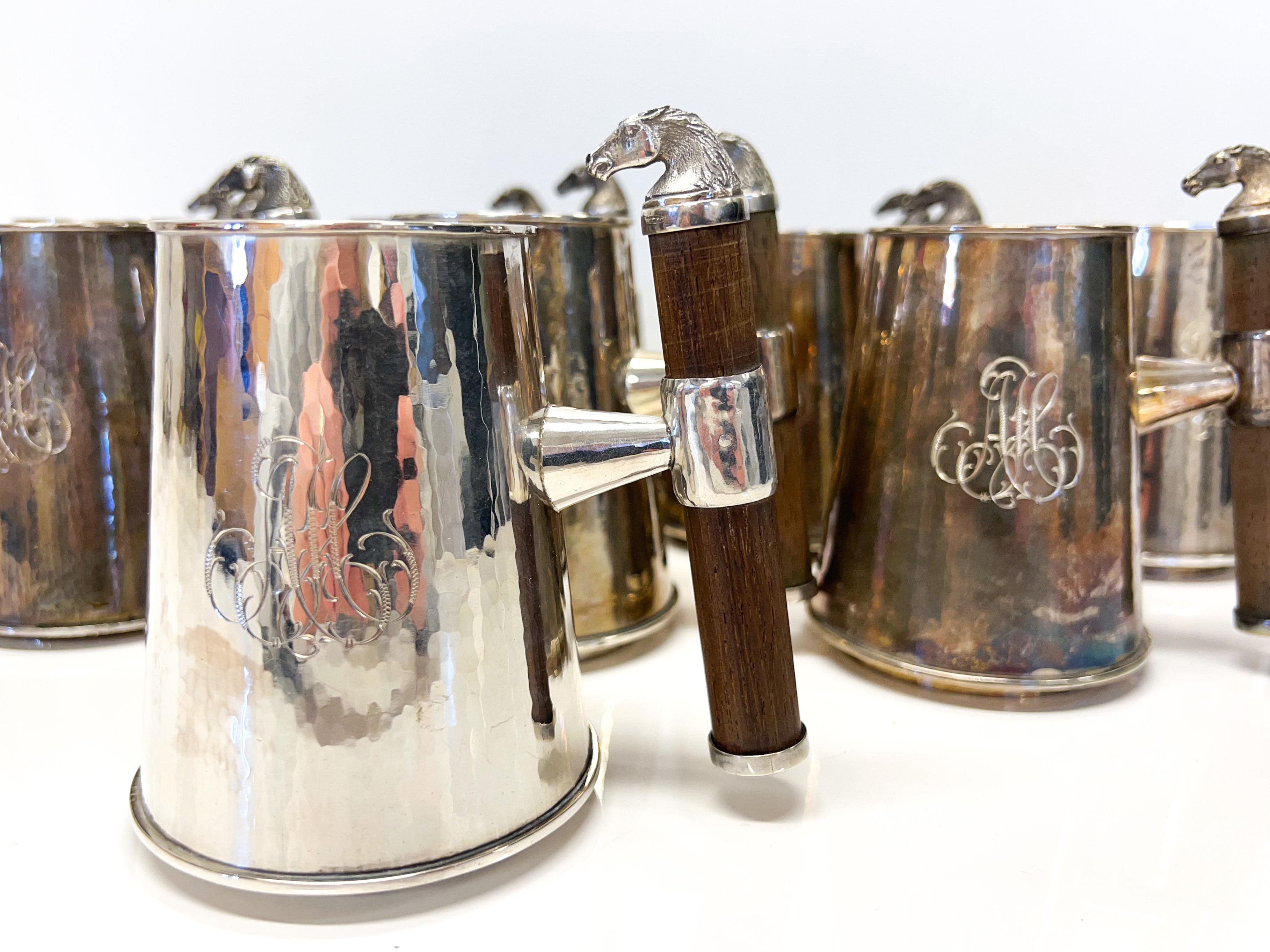 
Sterling Silver Beer Mugs with Horse decoration.
 Manufacturer: Kultaniemi Oy, which operated in Tampere from 1973-1977.
Handmade. 1975
Made in Finland.
Letter decoration in every pint.
Handle Wood and Silver.
One Mugs weighs about 230g.
Weight of