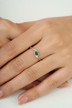 Sterling Silver Bezel Set Oval Emerald & Diamond Bypass Ring by Silvorra