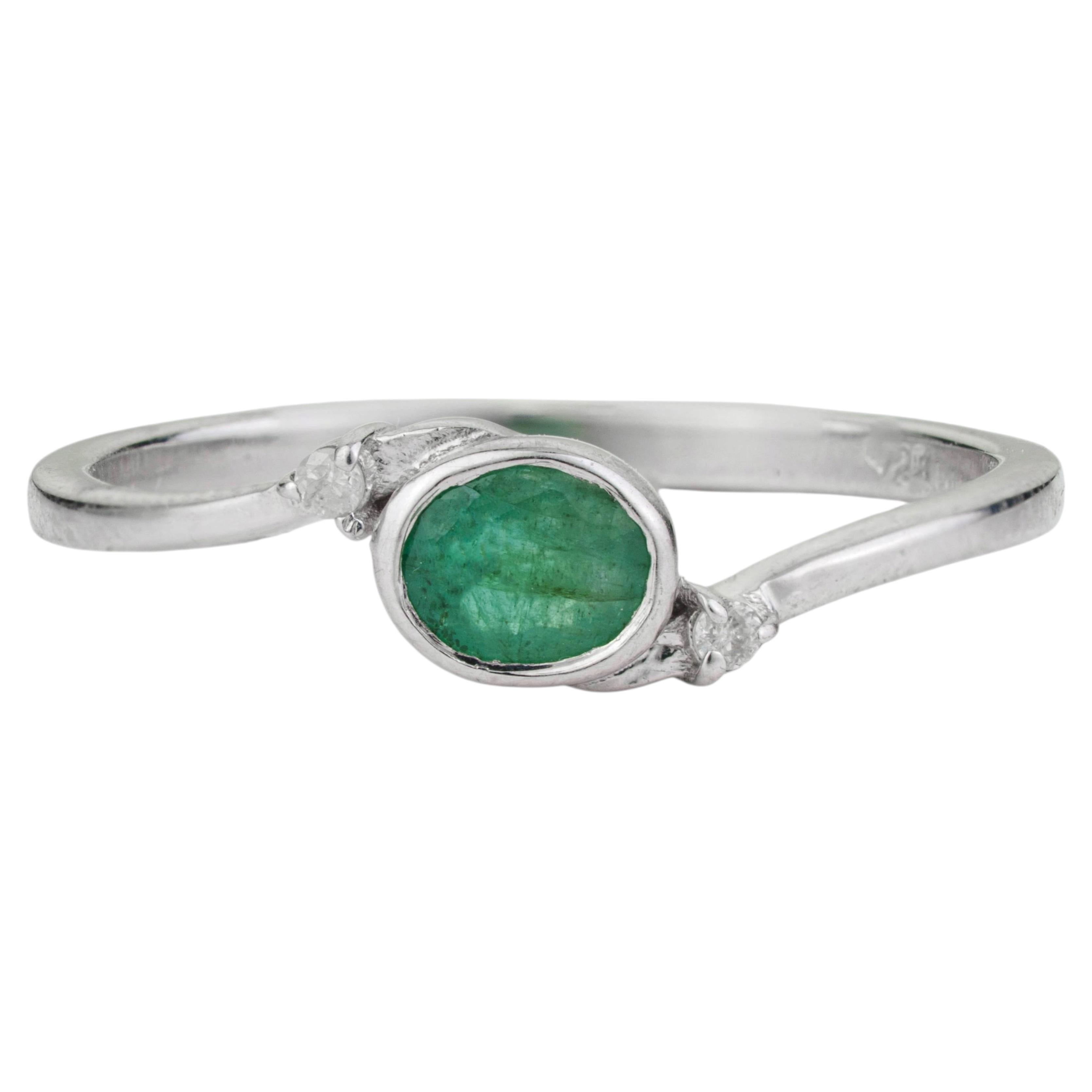 Sterling Silver Bezel Set Oval Emerald & Diamond Bypass Ring by Silvorra
