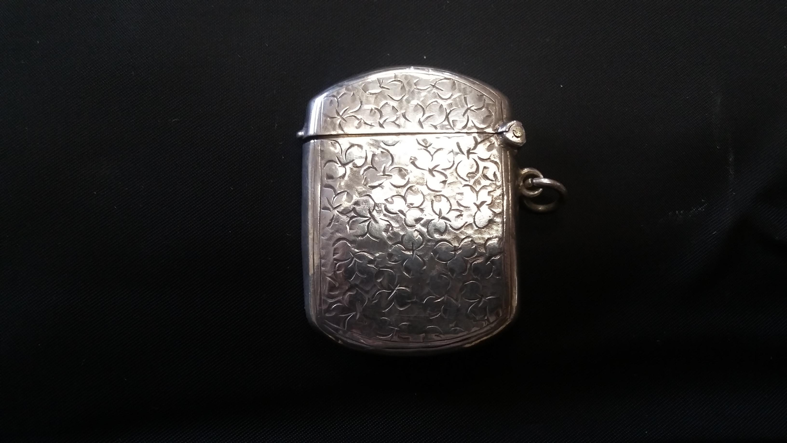 Beautiful and delicate sterling silver match safe holder. From English, circa 1915. Fine details front and back and marked on the inside (see pics). Has a clasp and potentially was worn around the neck. Great craftsmanship.