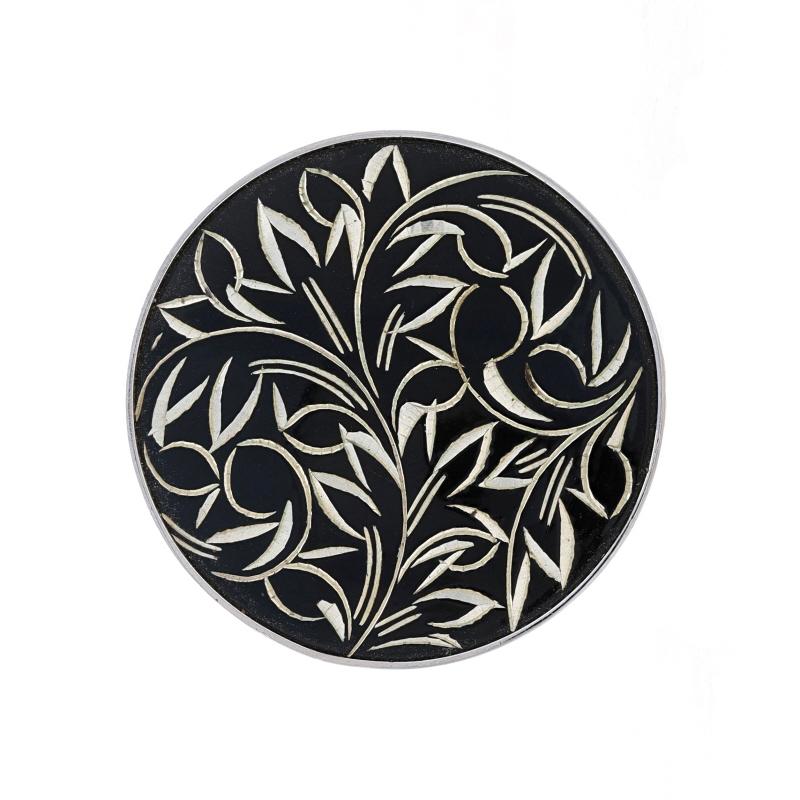 Brand: Amita

Metal Content: Sterling Silver

Material Information
Enamel
Color: Black

Style: Brooch
Fastening Type: Hinged Pin and Whale Tail Bullet Clasp
Theme: Botanical, Flowers
Features: Etched Design

Measurements
Diameter: 1 3/16