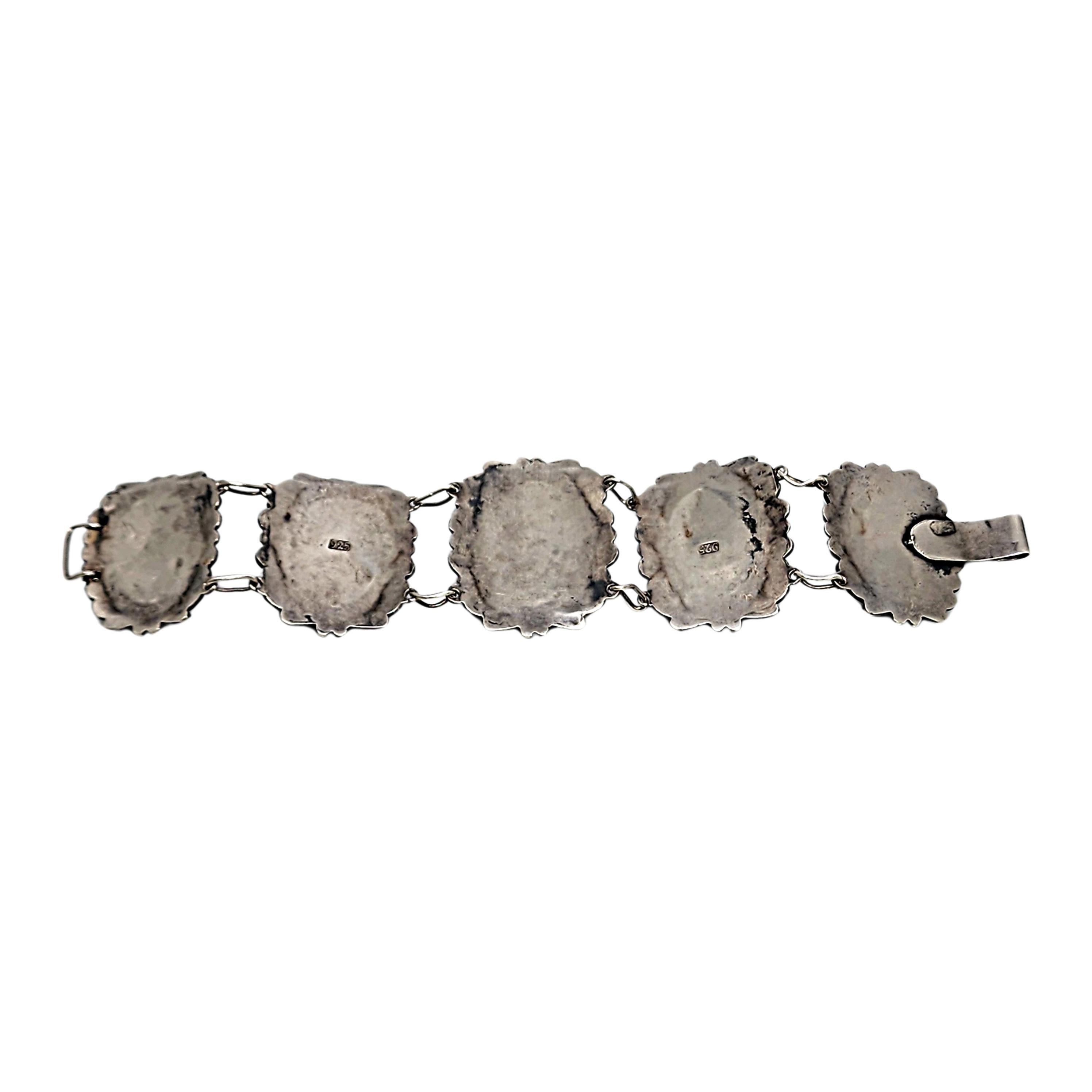 Sterling silver carved face black onyx filigree link bracelet.

Beautiful large and substantial bracelet featuring 5 filigree links each with a bezel set carved face of black onyx at its center. Hook closure.

Weighs approx 52.7g, 33.9dwt

Measures