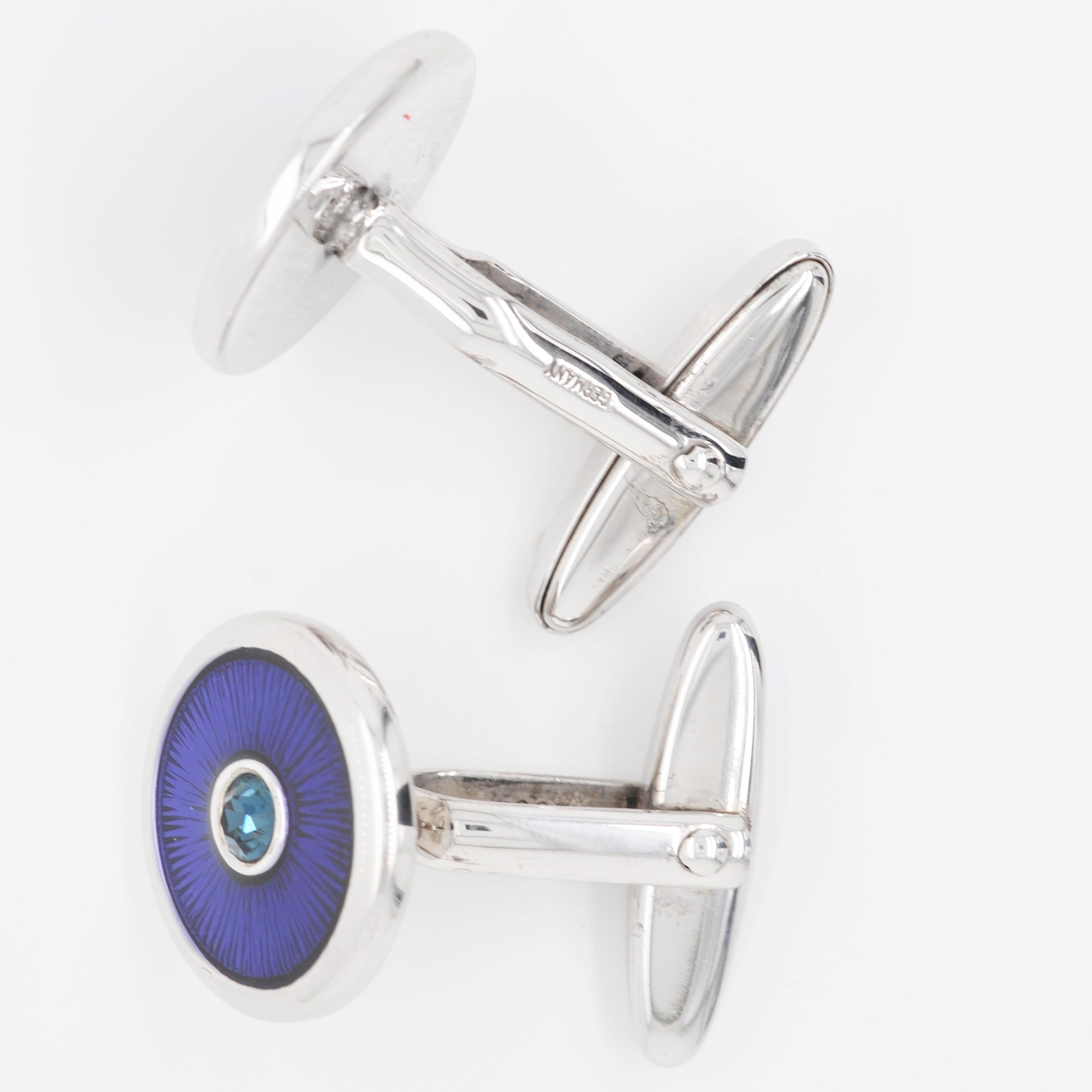 Made from Sterling Silver, these cufflinks are contemporary in style with a dash of blue colour. These round shaped cufflinks feature stunning Peacock Blue guilloche enamel with radiant patterns under the enamel, enveloped inside Sterling Silver