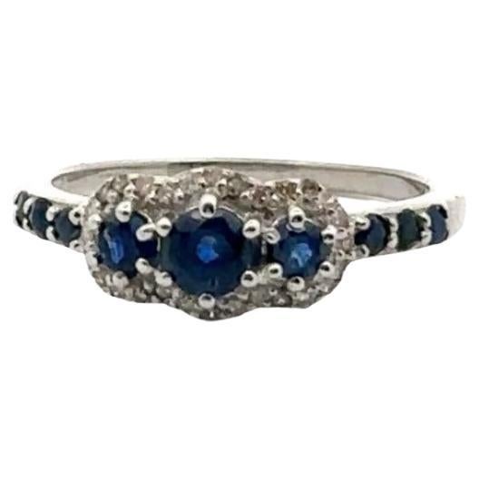 For Sale:  Sterling Silver Blue Sapphire Three Stone Diamond Halo Engagement Ring